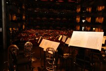 An attentive audience looks at instruments and sheet music on stage awaiting the President's Own Marine Band performance at Clowes Memorial Hall in Indianapolis, Sep. 7. The Hall at Butler University hosted the event and nearly 2,000 guests were in attendance.  