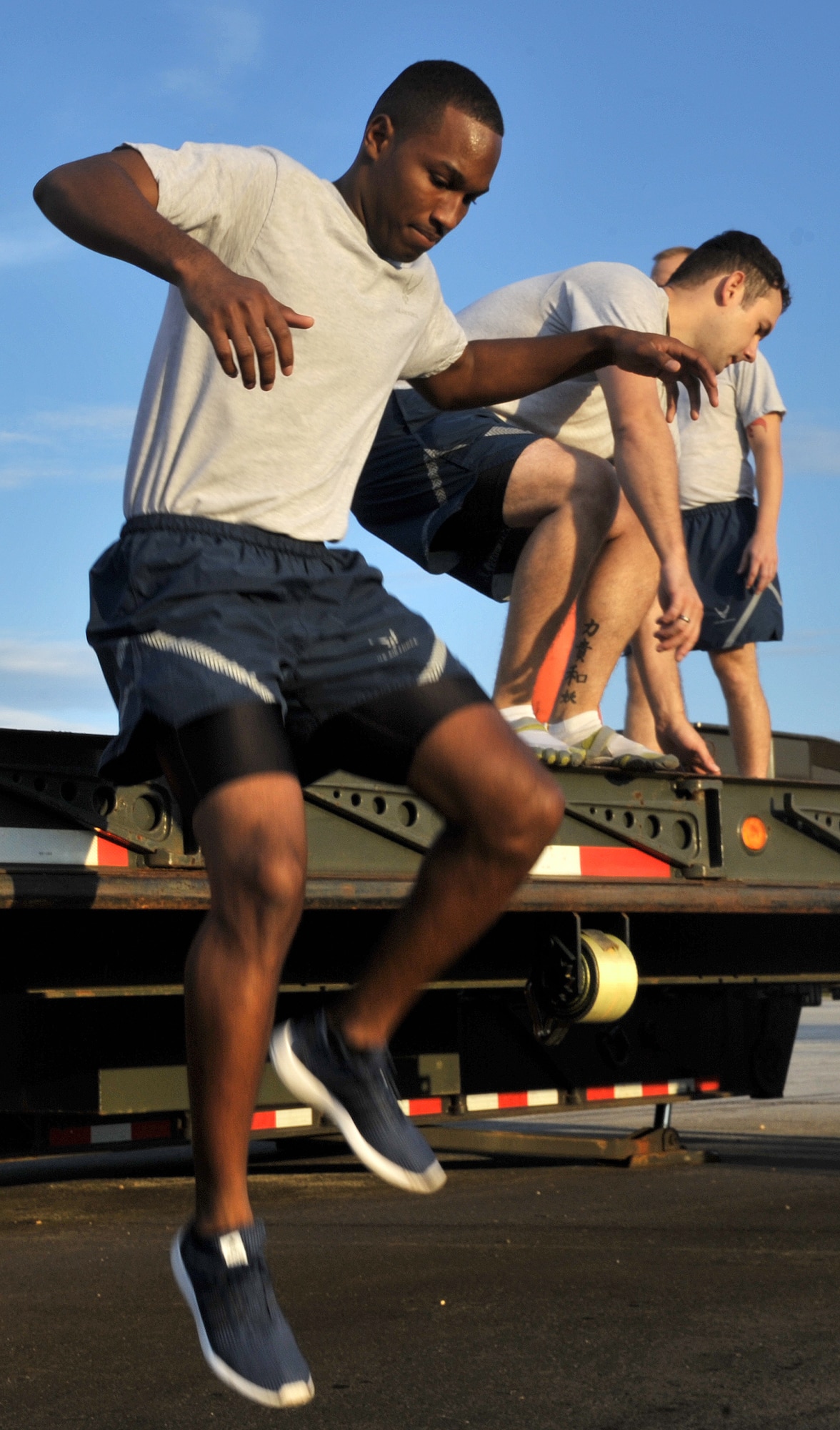 Senior Airman Xavier Blankenship jumps from the back of a trailer during the 2014 RED HORSE Rumble Obstacle course, Sept. 6, 2014 at Hurlburt Field, Fla. The event was held in conjuntion with the unit’s familiy day in order to boost morale and espirt de corps. (U.S. Air Force photo/Senior Airman Kentavist P. Brackin)