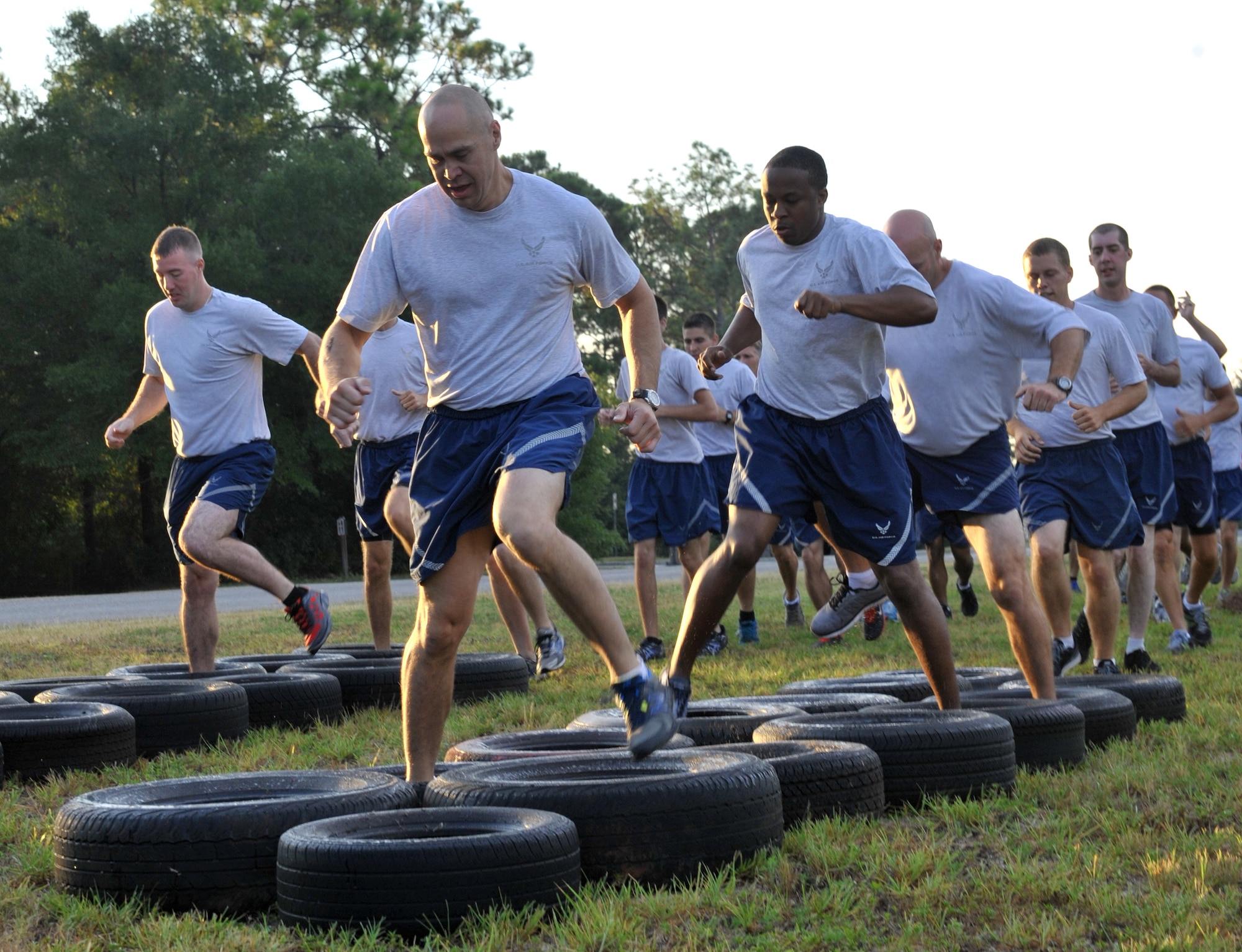 556th RED HORSE Squadron Airmen, run through tires during the 2014 RED HORSE Rumble Obstacle Course, Sept. 6, 2014 at Hurlburt Field, Fla. Airmen were split into two groups during the event,  the top three teams from each group received prizes. (U.S. Air Force photo/Senior Airman Kentavist P. Brackin)