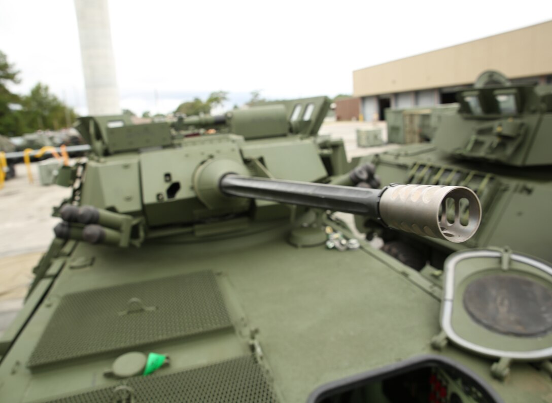 Light armored vehicle 25s stand staged at the 2nd Light Armored Reconnaissance Battalion ramp as Marines with Company B, Ground Combat Element Integrated Task Force, conducted a limited technical inspection of them, Sept. 9, 2014. The LAV-25 is a reconnaissance vehicle that can also employ a 25mm chain gun. From October 2014 to July 2015, the GCEITF will conduct individual and collective level skills training in designated ground combat arms occupational specialties in order to facilitate the standards-based assessment of the physical performance of Marines in a simulated operating environment performing specific ground combat arms tasks. (Official Marine Corps photo by Cpl. Paul S. Martinez/Released)