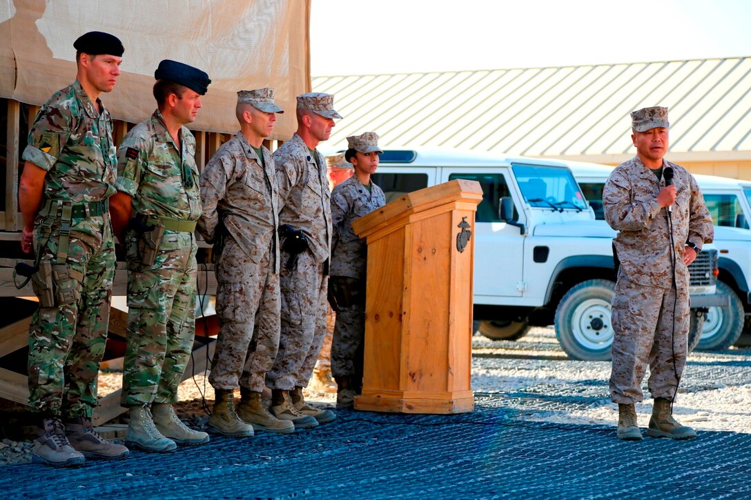 U.S. Marine Corps Brigadier Gen. Daniel D. Yoo, commanding general of Marine Expeditionary Brigade-Afghanistan, speaks during the 9/11 ceremony aboard Camp Leatherneck, Helmand province, Afghanistan, on Sep 11, 2014. The ceremony was held to commemorate the terrorist acts that occurred on September 11, 2001. (Official U. S. Marine Corps photo by Sgt. Dustin D. March/Released)