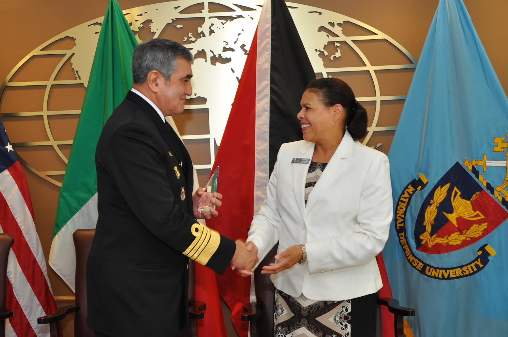 NDU Interim President Ambassador Wanda L. Nesbitt congratulates Admiral José Santiago Valdés Álvarez of Mexico on his induction into the International Fellows Hall of Fame on September 3, 2014.