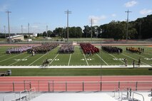 Marines with 2nd Marine Logistics Group, II Marine Expeditionary Force stand in formation at the beginning of the barracks bash at Goettge Memorial Field aboard Marine Corps Base Camp Lejeune, N.C., Aug. 27, 2014. Each unit sported a different color including white (Combat Lagistics Regiment 27), green (Combat Lagistics Regiment25), brown (Combat Lagistics Regiment 2), yellow (Dental Battalion), blue (Medical Battalion), and red (8th Engineer Support Battalion).