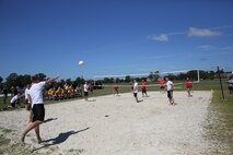 Marines with 2nd Marine Logistics Group, II Marine Expeditionary Force play a game of volleyball during the barracks bash at Goettge Memorial Field aboard Marine Corps Base  Camp Lejeune, N.C., Aug. 27, 2014.The overall goal of the barracks bash was to maintain unit cohesion and build camaraderie amongst Marines by competing in several sport events. (Marine Corps photo by Lance Cpl. Tyler Andersen)