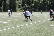 Marines with 2nd Marine Logistics Group, II Marine Expeditionary Force plays soccer during the barracks bash at Goettge Memorial Field aboard Marine Corps Base Camp Lejeune, N.C., Aug. 27, 2014. The overall goal of the barracks bash was to maintain unit cohesion and build camaraderie amongst Marines by competing in several sport events. (Marine Corps photo by Lance Cpl. Tyler Andersen)