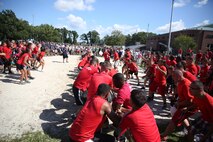 Marines with 2nd Marine Logistics Group, II Marine Expeditionary Force play a game of tug-of-war during the barracks bash at Goettge Memorial Field aboard Marine Corps Base Camp Lejeune, N.C., Aug. 27, 2014. The overall goal of the barracks bash was to maintain unit cohesion and build camaraderie amongst Marines by competing in several sport events. (Marine Corps photo by Lance Cpl. Tyler Andersen)