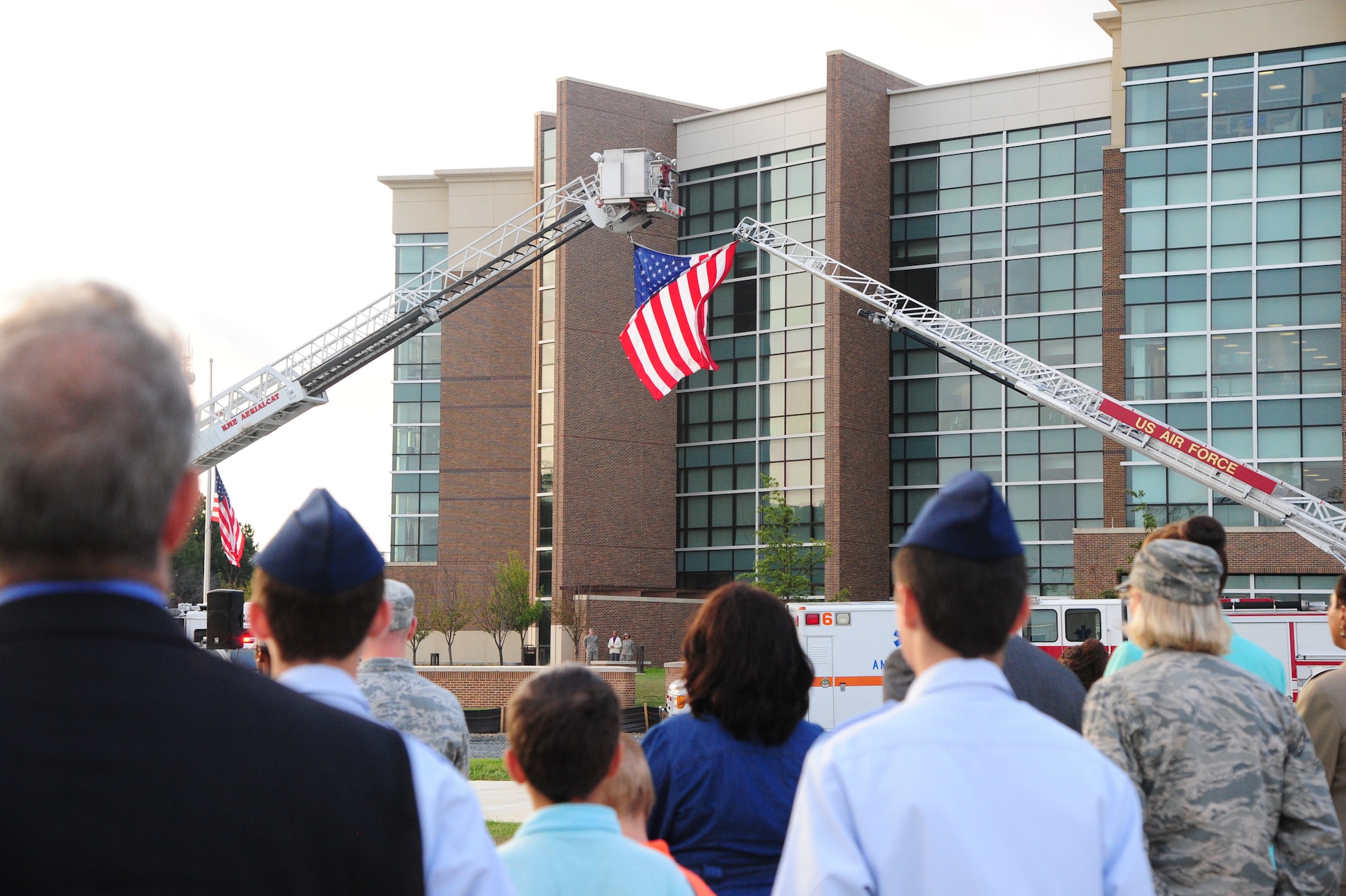 Airmen and civilians from Joint Base Andrews, Md., share a moment of silence during morning reveille on Sept. 11, 2001. The morning reveille paid respect to all those who lost their lives in the Sept. 11, 2001 attacks. (U.S. Air Force photo/Airman 1st Class J.D. Maidens)