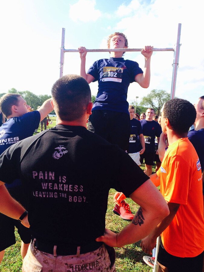 PENNSAUKEN, N.J. – More than 60 Marine Corps poolees line up to conduct pull-ups to show their support at the 9/11 Heroes 5K run in Pennsauken, N.J., Sept. 7, 2014. The run was created to commemorate fallen military service members, police officers, firefighters, and emergency responders.
