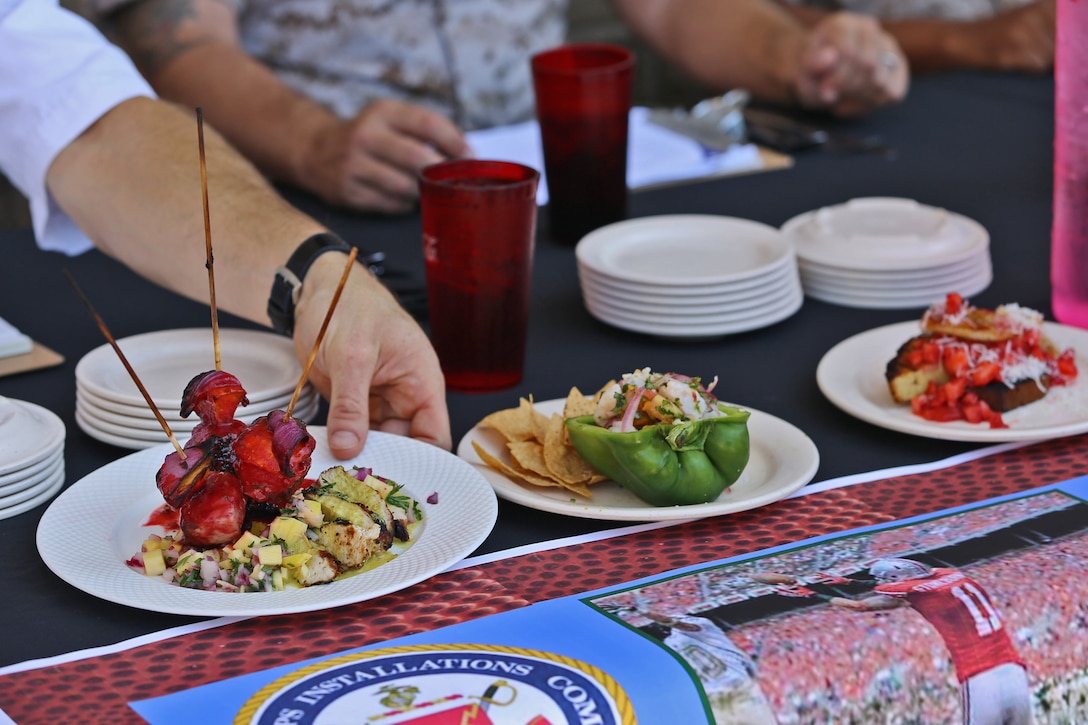 The 22 Area Mess Hall hosted the Marine Corps Installations- West, Chef of the Quarter Culinary Competition, Sept. 9-10, in partnership with Sodexo. The competition started off with twelve teams who were assessed for their culinary knowledge and proficiency through written and verbal quizzes. The top four teams continued to a cook-off stage, where they were given three proteins and fresh ingredients to prepare a high-quality menu. The first place winners were awarded priority seats for a two-month course at the Culinary Institute or America and a Certificate of Commendation from Brig. Gen. Edward D. Banta, the commanding general of MCI-West, MCB Camp Pendleton. (U.S. Marine Corps photo by Cpl. Shaltiel Dominguez)
