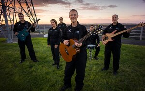 U.S. Air Force Band of the Golden West rock ensemble "Mobility" poses for a photo in Twin Falls, Idaho, Sept. 8, 2014. The band performs popular music from the past 50 years to bolster support for the Air Force's mission and inspire patriotism. (U.S. Air Force photo by Tech. Sgt. Samuel Morse/Released)