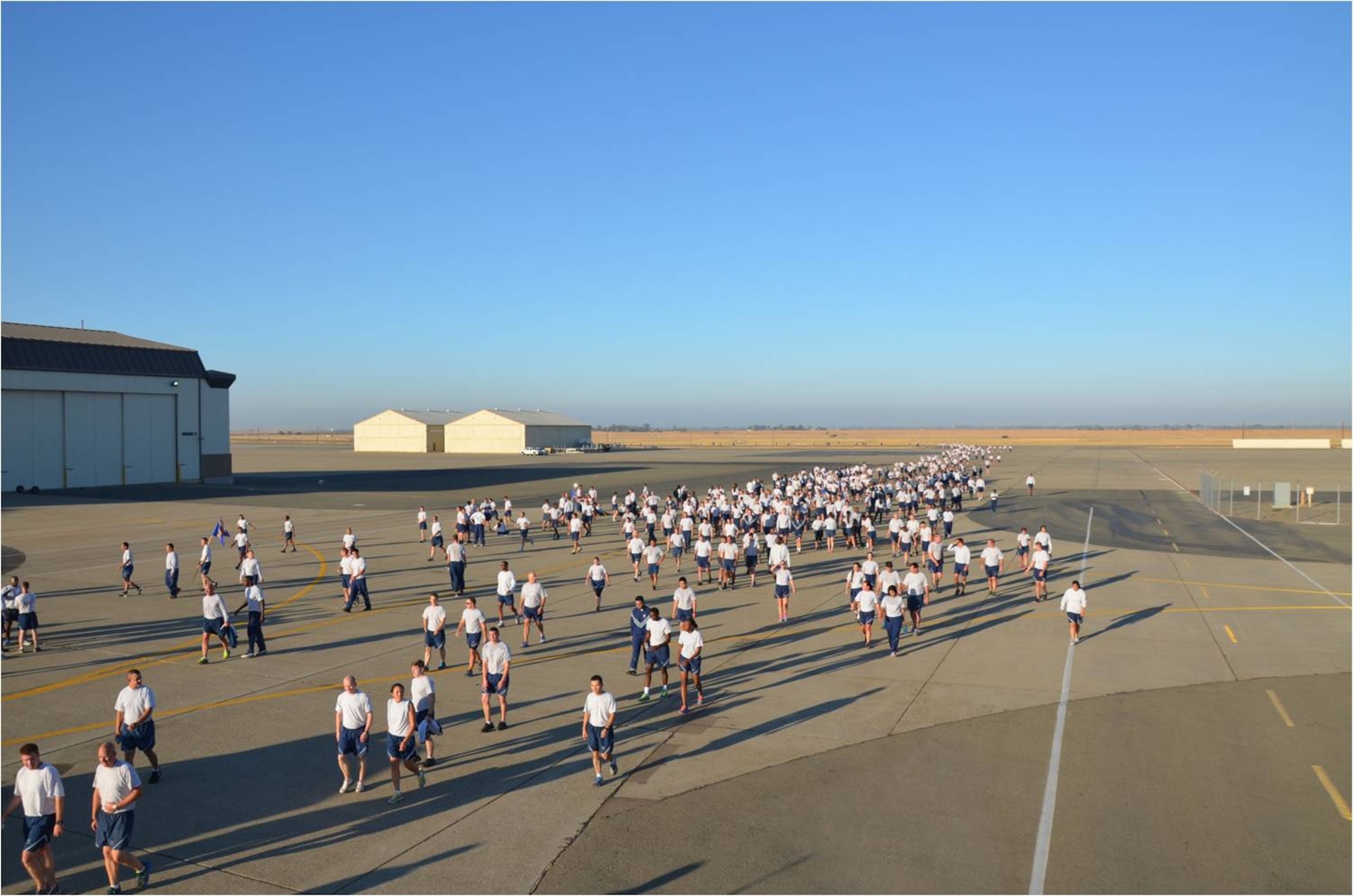Members of the 9th Reconnaissance Wing participate in a wing run on the flight line at Beale Air Force Base, Calif., Sept. 8, 2014.  The run was part of a Comprehensive Airman Fitness day focused on building resiliency through physical fitness. (U.S. Air Force photo by Staff Sgt. Robert M. Trujillo/Released)