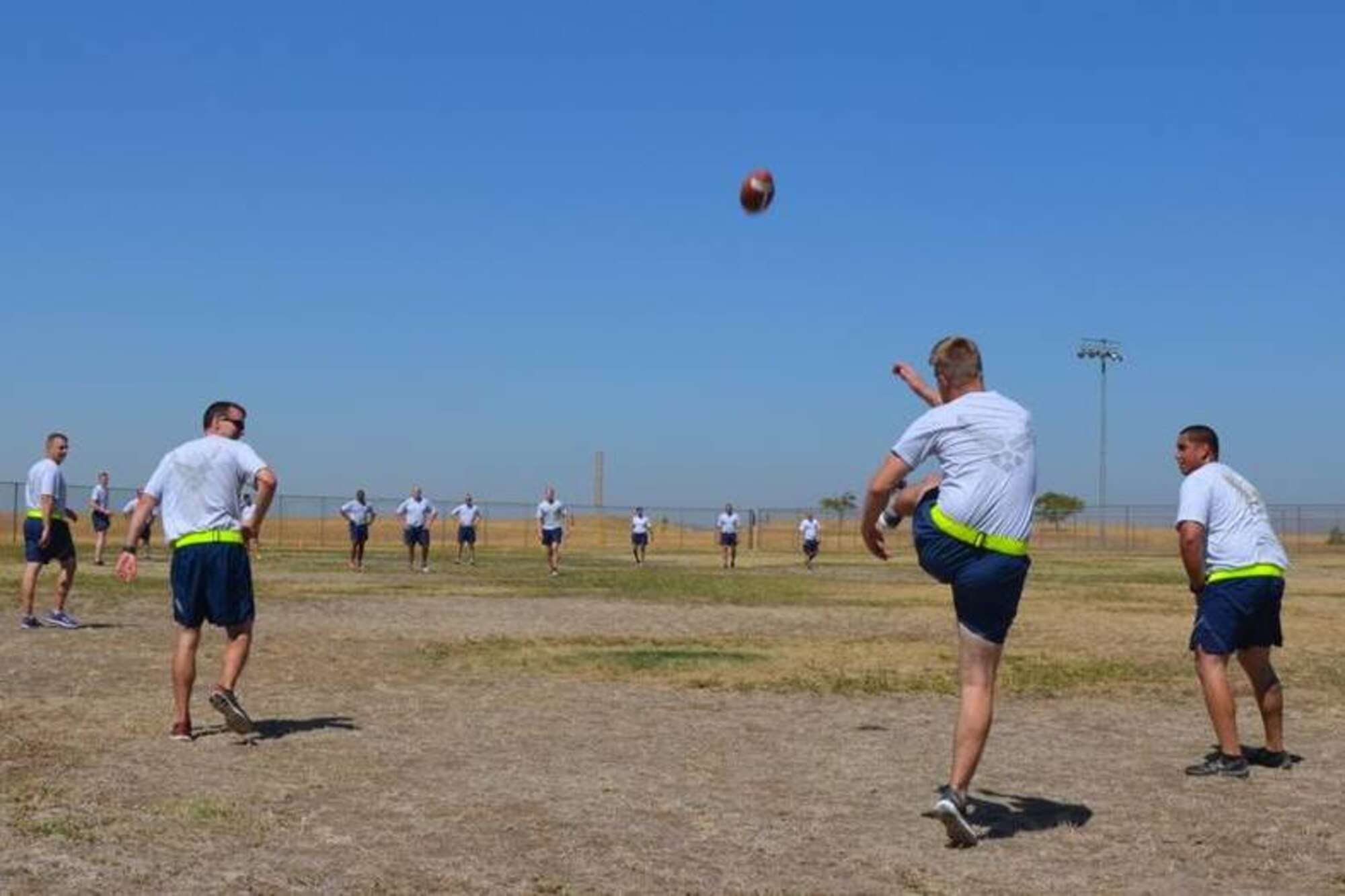 Team Beale members play ultimate football ball at Beale Air Force Base, Calif., Sept. 8, 2014.  This activity was part of a Comprehensive Airman Fitness day focused on building resiliency through physical fitness.  (Courtesy photo)