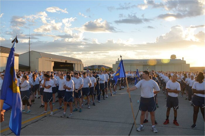 Members of the 9th Reconnaissance Wing gather on the flight line at Beale Air Force Base, Calif., Sept. 8, 2014.  A commander’s call and wing run were held as part of a Comprehensive Airman Fitness day. (U.S. Air Force photo by Staff Sgt. Robert M. Trujillo/Released)