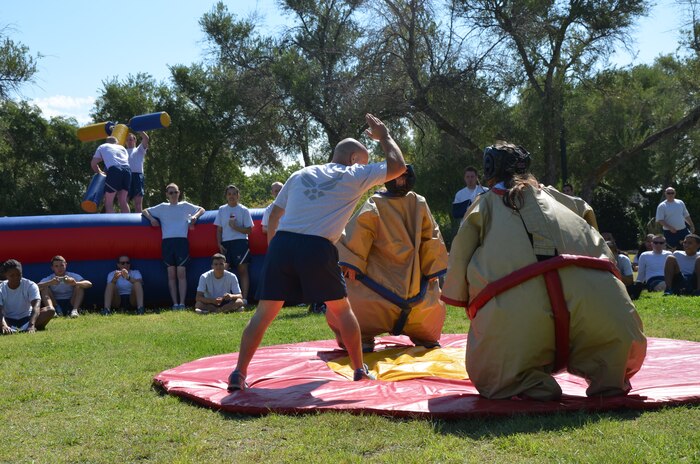 Team Beale members wearing sumo suits prepare to wrestle during a Comprehensive Airman Fitness day at Beale Air Force Base, Calif., Sept. 8, 2014.   The event focused on building resiliency skills through physical fitness. (Courtesy photo)