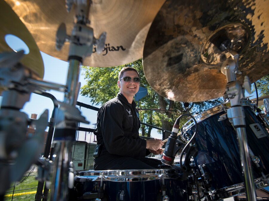 U.S. Air Force Tech. Sgt. Timothy Shaw smiles for the camera at Air Force Appreciation Day in Mountain Home, Idaho, Sept. 6, 2014. Mobility is a high-tempo rock band that travels around the western U.S. to perform for various events. (U.S. Air Force photo by Airman 1st Class Brittany A. Chase/Released)