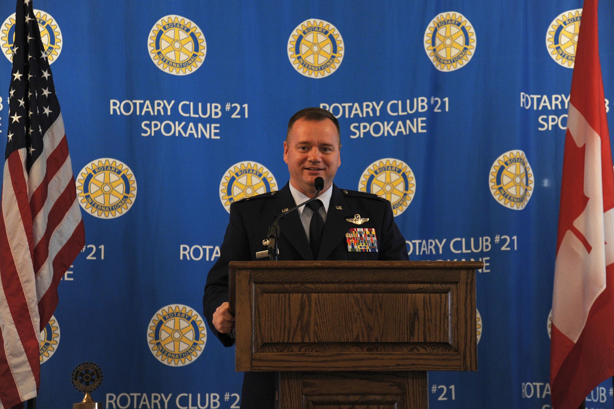 Col. Brian McDaniel, 92nd Air Refueling Wing commander, speaks to more than 100 members of the Spokane Rotary 21 Club at the Spokane Club in Spokane, Washington, Sept. 11, 2014. McDaniel talked about the importance of Fairchild’s mission and thanked the community for their continued support to Fairchild Airmen and their families. (U.S. Air Force photo by Airman 1st Class Janelle Patiño/Released)