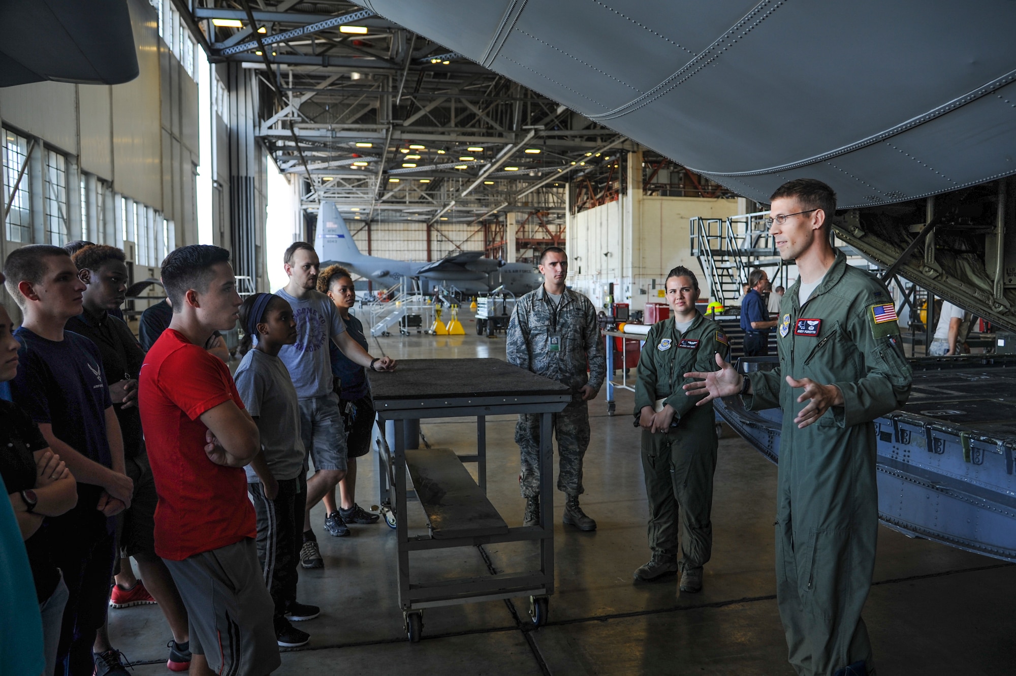1st Lt. Andrew Forsyth, a 41st Airlift Squadron C-130J pilot, speaks to a group of Air Force recruits Aug. 21, 2014, at Little Rock Air Force Base, Ark. Forsyth discussed the importance of combat airlift and how C-130 pilots rely on loadmasters to accomplish the mission. (U.S. Air Force photo by Airman 1st Class Harry Brexel) 