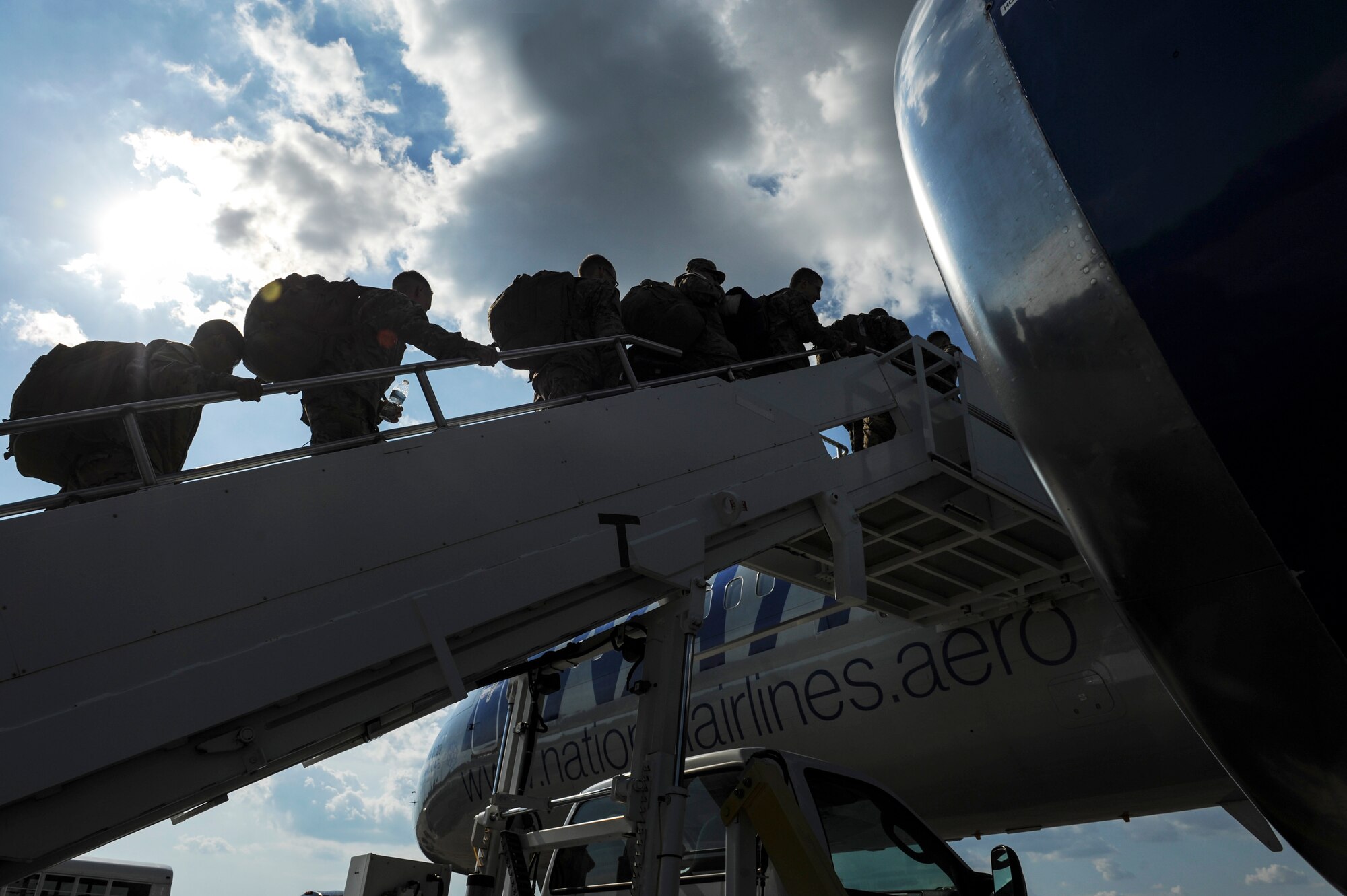 Team Little Rock members board a rotator Sept. 5, 2014, at Little Rock Air Force Base, Ark. More than 300 TLR Airmen are currently deployed around the globe supporting wartime and contingency operations. (U.S. Air Force photo by Airman 1st Class Cliffton Dolezal) 