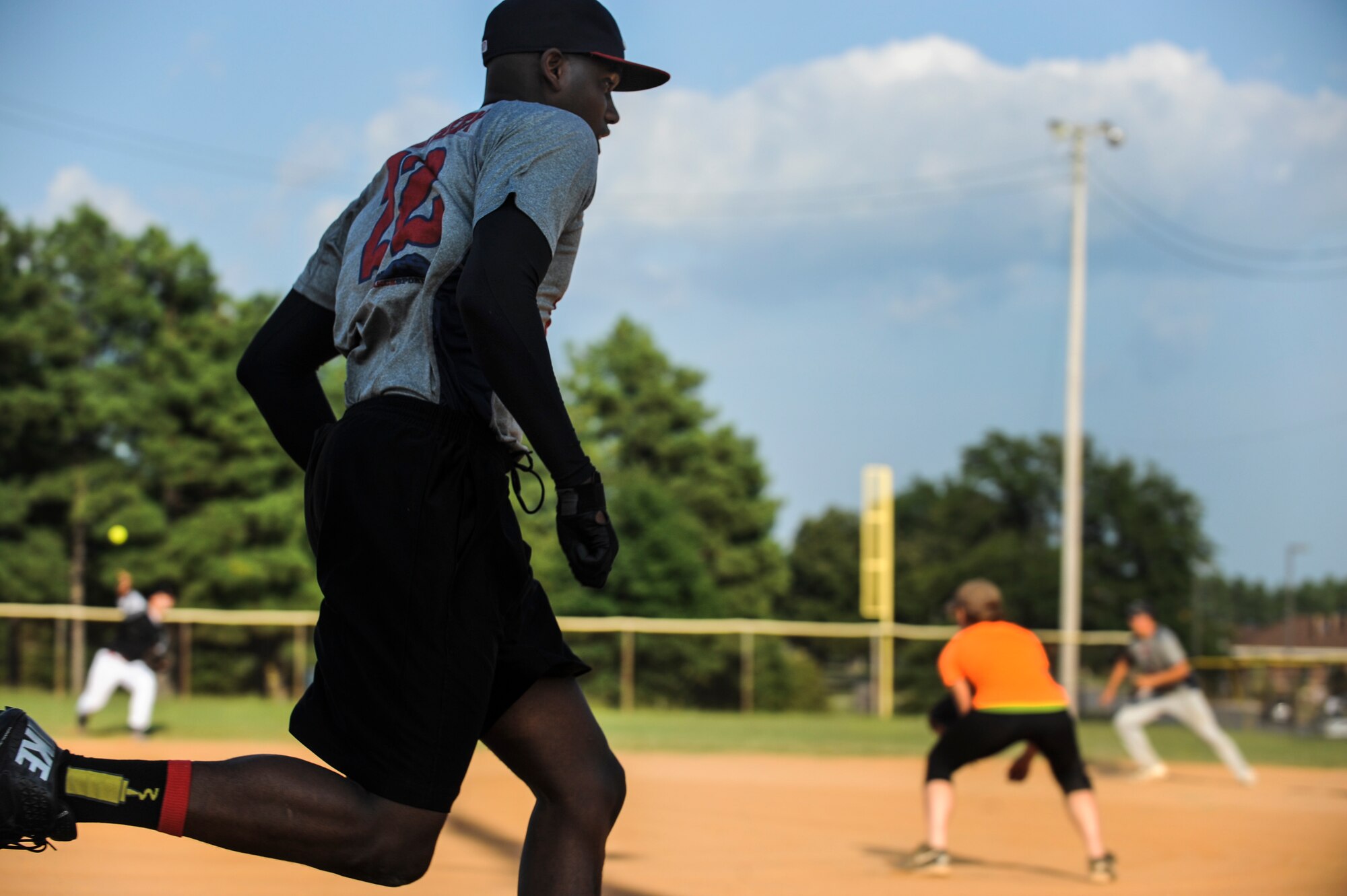 Senior Airman Darrius Northern, the 19th Logistics Readiness Squadron center fielder, rounds third base and heads to home plate during the intramural softball championship game Aug. 27, 2014 at Little Rock Air Force Base, Ark. The 19th LRS finished their season with a record of 9-2 and capped off their season with an 18-5 victory over the 19th Aircraft Maintenance Squadron to win the championship. (U.S. Air Force photo by Airman 1st Class Cliffton Dolezal)