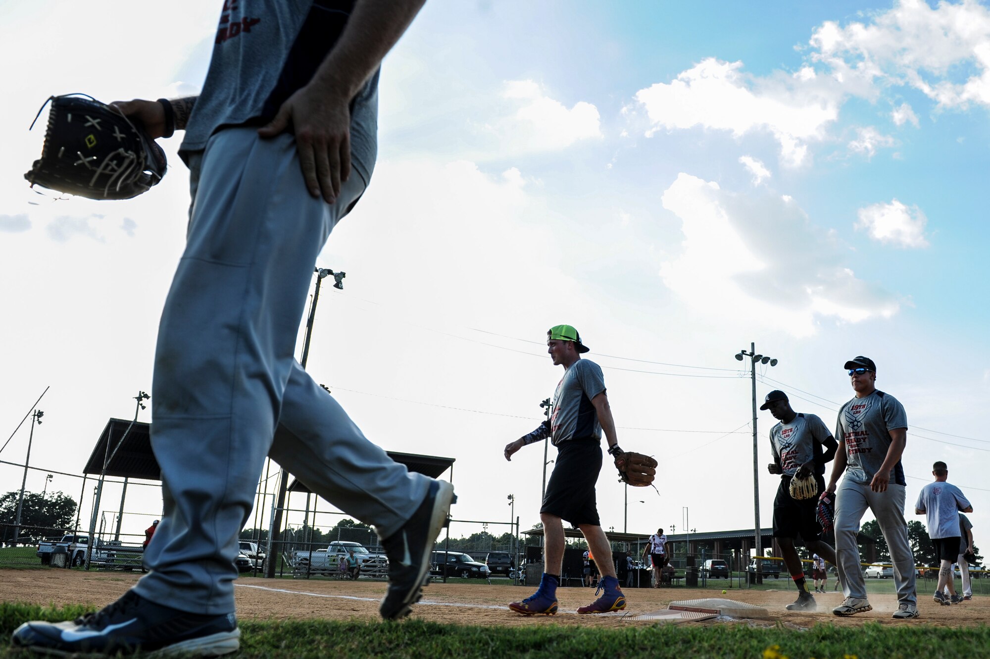 The 19th Logistics Readiness Squadron softball team heads to their dugout after the third inning during the intramural softball championship game Aug. 27, 2014 at Little Rock Air Force Base, Ark. The 19th LRS was crowned softball champs after defeating the 19th Aircraft Maintenance Squadron 18-5. (U.S. Air Force photo by Airman 1st Class Cliffton Dolezal)