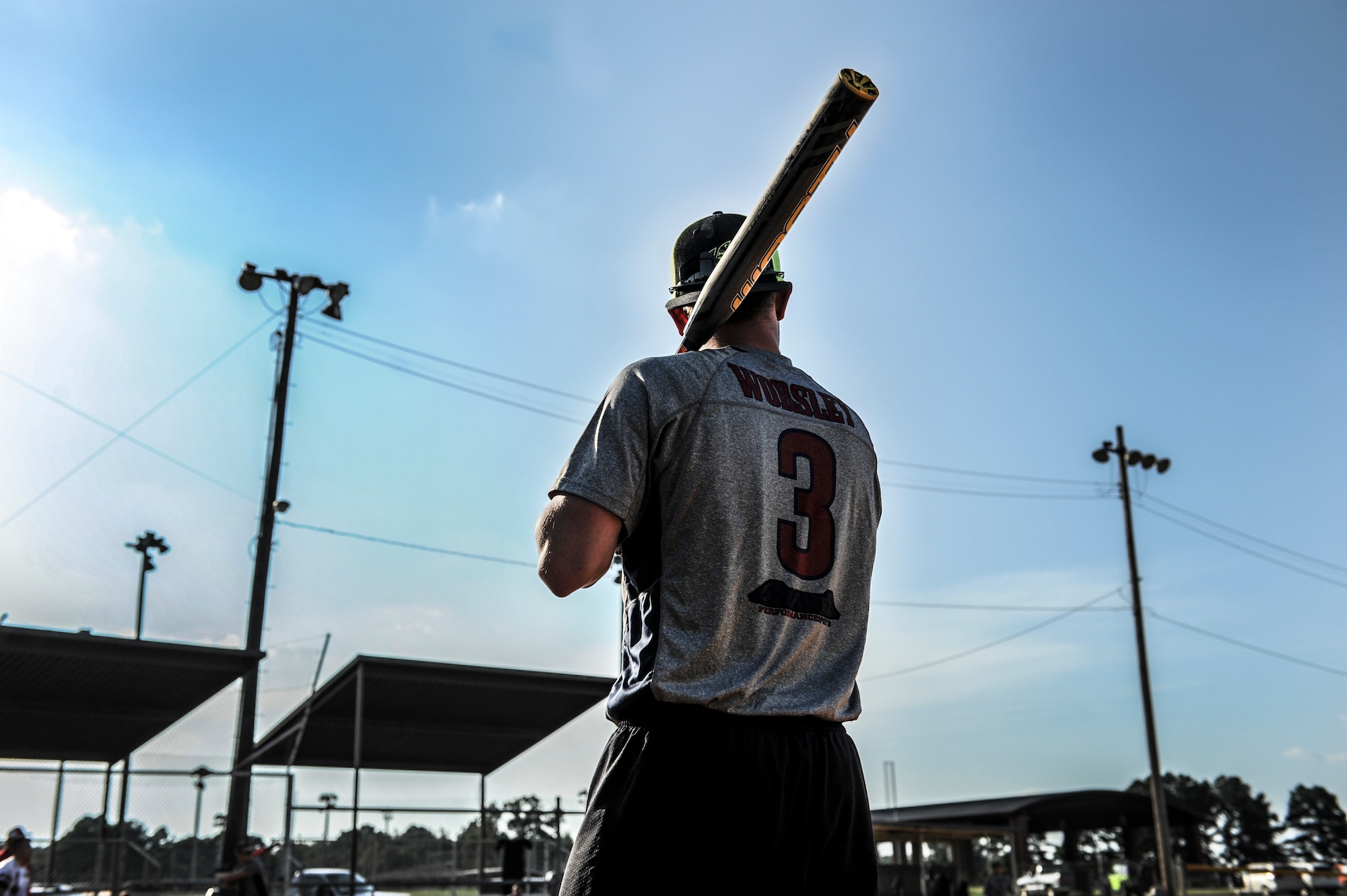 Airman 1st Class Troy Worsley, the 19th Logistics Readiness Squadron shortstop, warms up before his turn at bat during the intramural softball championship game Aug. 27, 2014 at Little Rock Air Force Base, Ark. The 19th LRS defeated the 19th Aircraft Maintenance Squadron 18-5. (U.S. Air Force photo by Airman 1st Class Cliffton Dolezal)