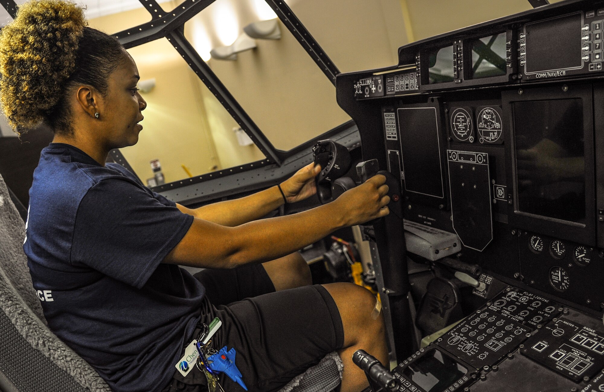 An Arkansan enrolled in the Delayed Entry Program, grabs the wheel of a maintenance training C-130J Aug. 21, 2014, at Little Rock Air Force Base, Ark. More than 20 members from the DEP toured the base to learn more about Air Force career fields. (U.S. Air Force photo by Airman 1st Class Harry Brexel)