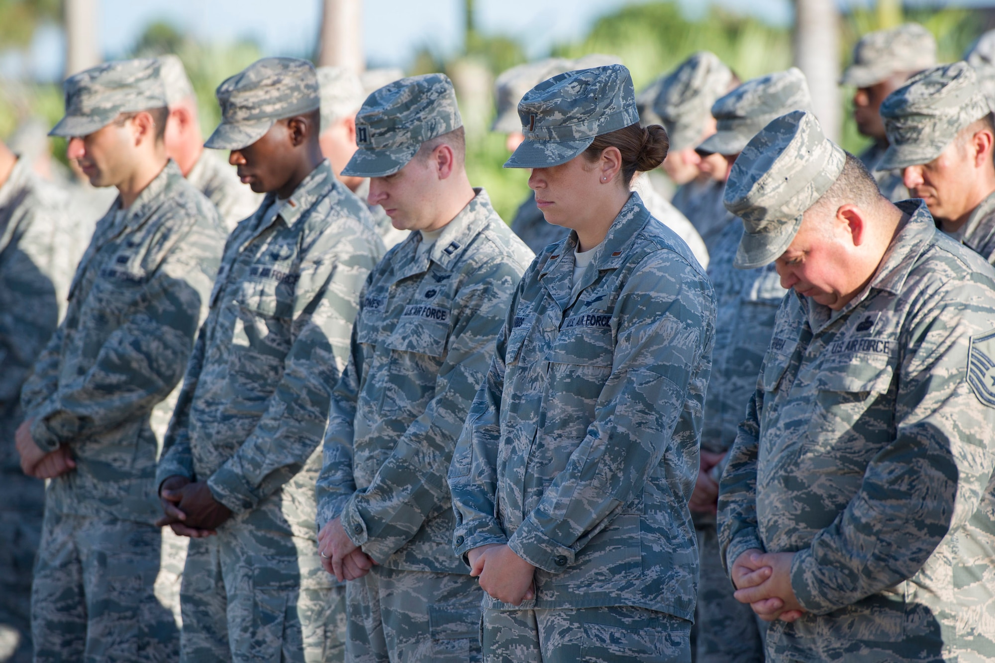 Members of Team Patrick-Cape bow their heads in a moment of silence to honor the memory of each life. Ceremonies were planned around the nation on the anniversary of the 9/11 terrorist attacks, which involved the loss of nearly 3,000 lives and collapse of the World Trade Center towers in New York City, and fatal airplane crashes that occurred at the Pentagon and in Pennsylvania.  (U.S. Air Force Photo/Matthew Jurgens) (Released)