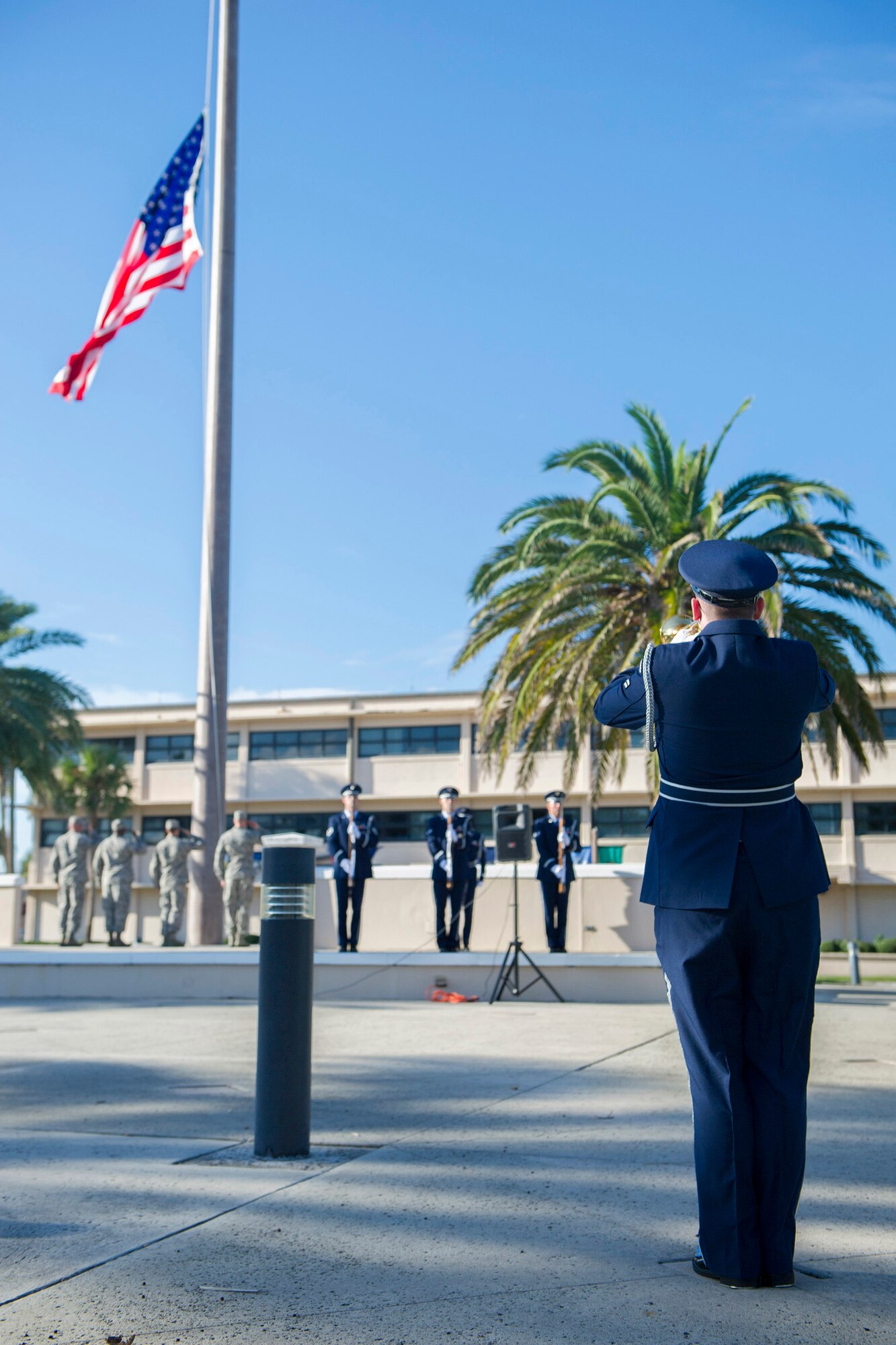 A member of the 45th Space Wing Honor Guard plays Taps during the 9/11 Patriot Day remembrance ceremony at Patrick Air Force Base, Florida, Sept. 11, 2014. The ceremony paid tribute to those who lost their lives on that unforgettable day in American history. (U.S. Air Force photo/Matthew Jurgens) (Released) 