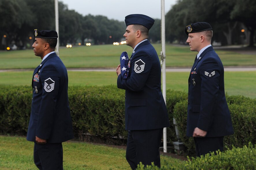 Barksdale Airmen prepare to raise the flag during the 9/11 Remembrance Ceremony on Barksdale Air Force Base, La., Sept. 11, 2014. The flag was raised and then lowered to half-staff to honor those who lost their lives Sept. 11, 2001. (U.S. Air Force photo/Senior Airman Jannelle Dickey)