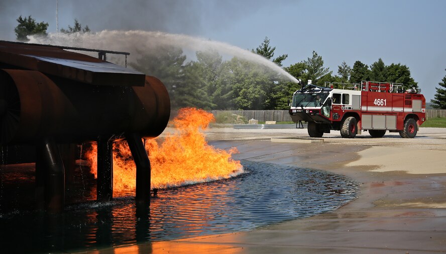 Firefighters from the 932nd Airlift Wing train on putting out an aircraft fire using a special fire truck designed for airports Aug. 22, 2014 at the Scott Air Force Base fire training grounds.  (U.S. Air Force photo/Tech. Sgt. Christopher Parr)