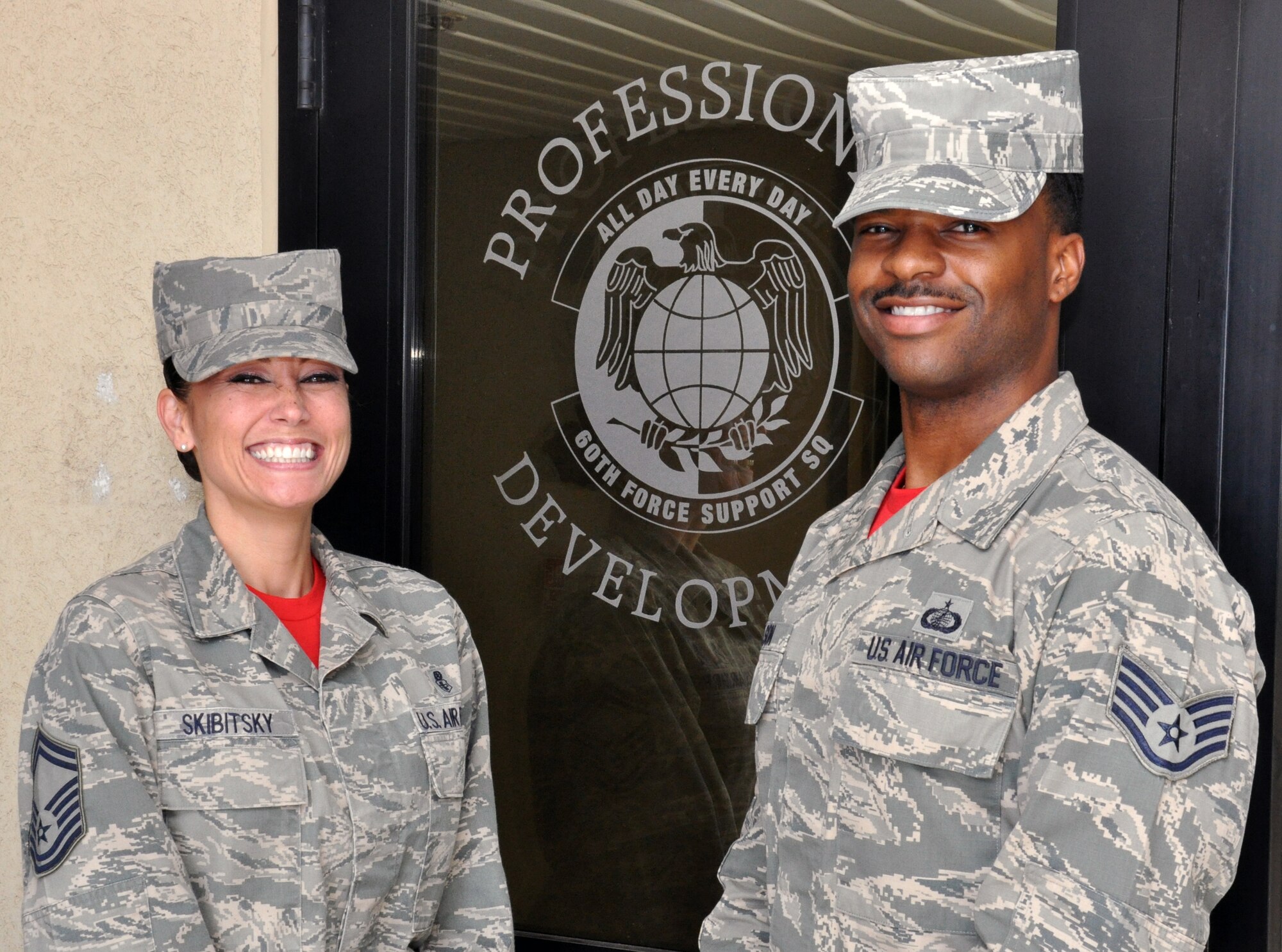 Senior Master Sgt. Hope Skibitsky, Career Assistance Advisor, and Staff Sgt. Charles Wilson, First Term Airrmen Center team leader, stand in front of the CAA's office Sept. 5 at Travis Air Force Base. The CAA and FTAC are located next door to the education center on Hickam Avenue. (U.S. Air Force photo by Staff Sgt. Christopher Carranza)