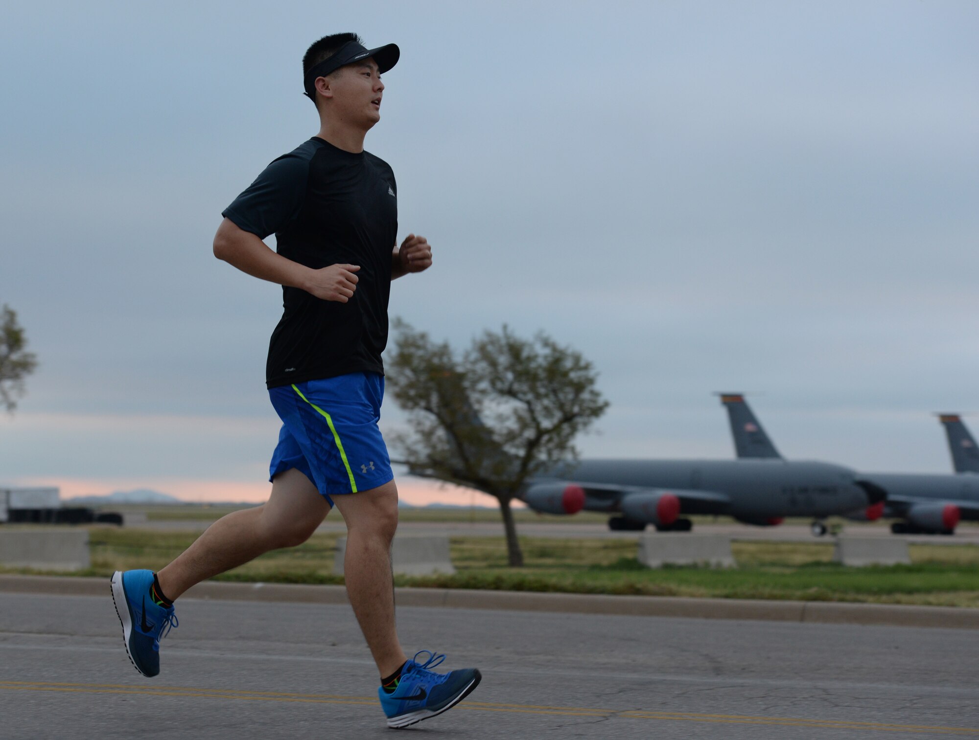 A participant runs during the 9/11 Run to Remember, Sept. 11, 2014, Altus AFB. Fifty-six runners ran the 11-mile course in remembrance of victims of the Sept. 11, 2001 attacks. (U.S. Air Force photo by Airman 1st Class Nathan Clark/Released)