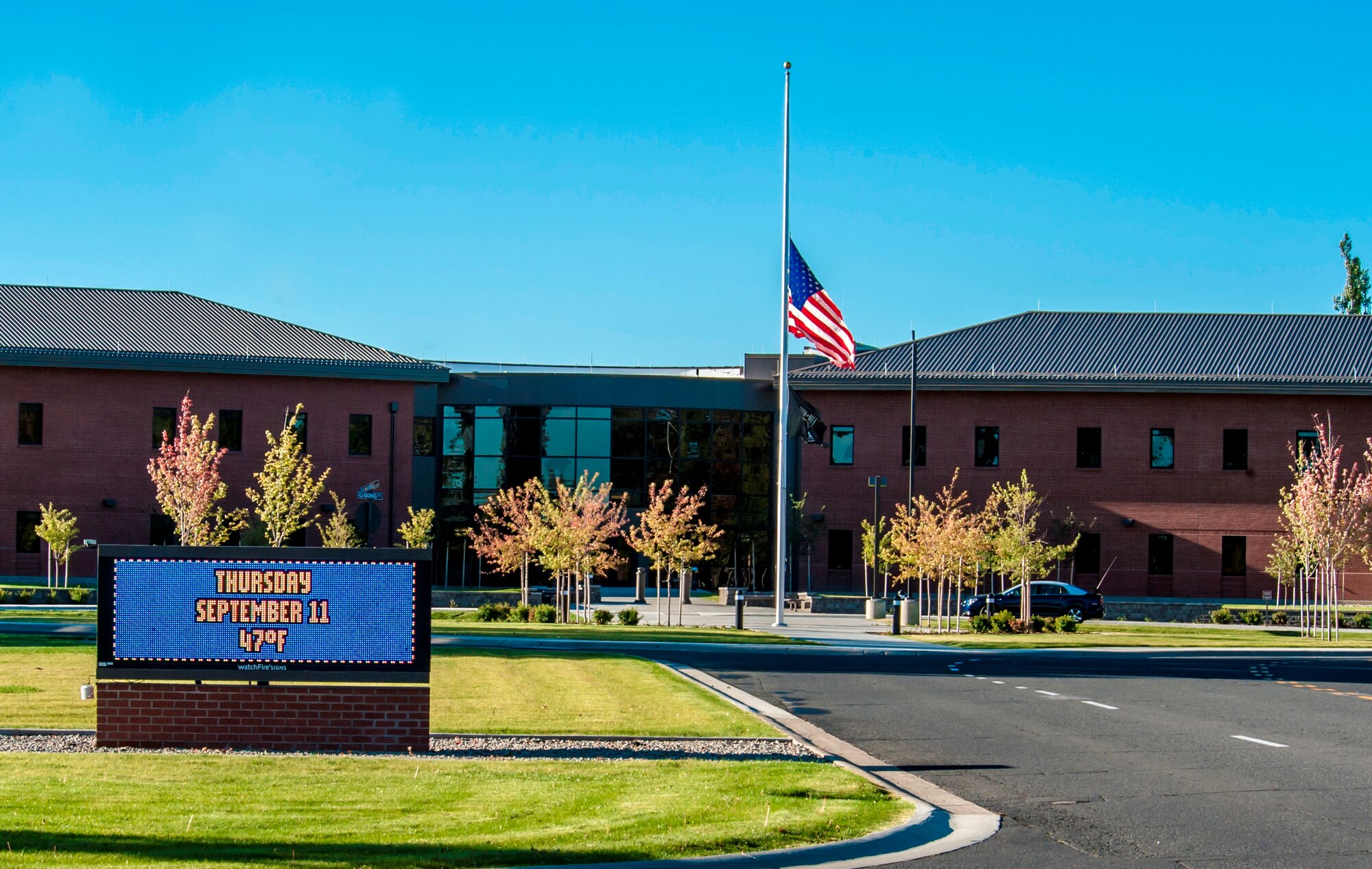 The American and prisoners of war/missing in action flags fly at half-staff at Fairchild Air Force Base, Washington, in honor of the 2,977 innocent lives lost on 9/11 in New York, the Pentagon and fields of Pennsylvania, Sept. 11, 2014. Although more than a decade has passed since the Sept. 11 attacks, time will never replace the lives lost on that day. The base will hold a remembrance ceremony today at 4 p.m. at the wing flag pole. (U.S. Air Force photo by Staff Sgt. Benjamin W. Stratton/Released)