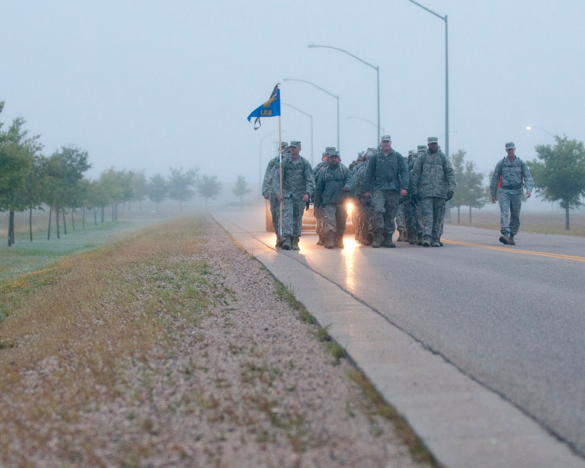 Ninetieth Logistics Readiness Squadron Airmen conduct a ruck march along the streets of F.E. Warren Air Force Base, Wyo., Sept. 11, 2014. The Airmen marched in remembrance of the Sept. 11 attacks against the U.S. and to honor F.E. Warren's first responders on the 13th anniversary of the attacks. (U.S. Air Force photo by Lan Kim)