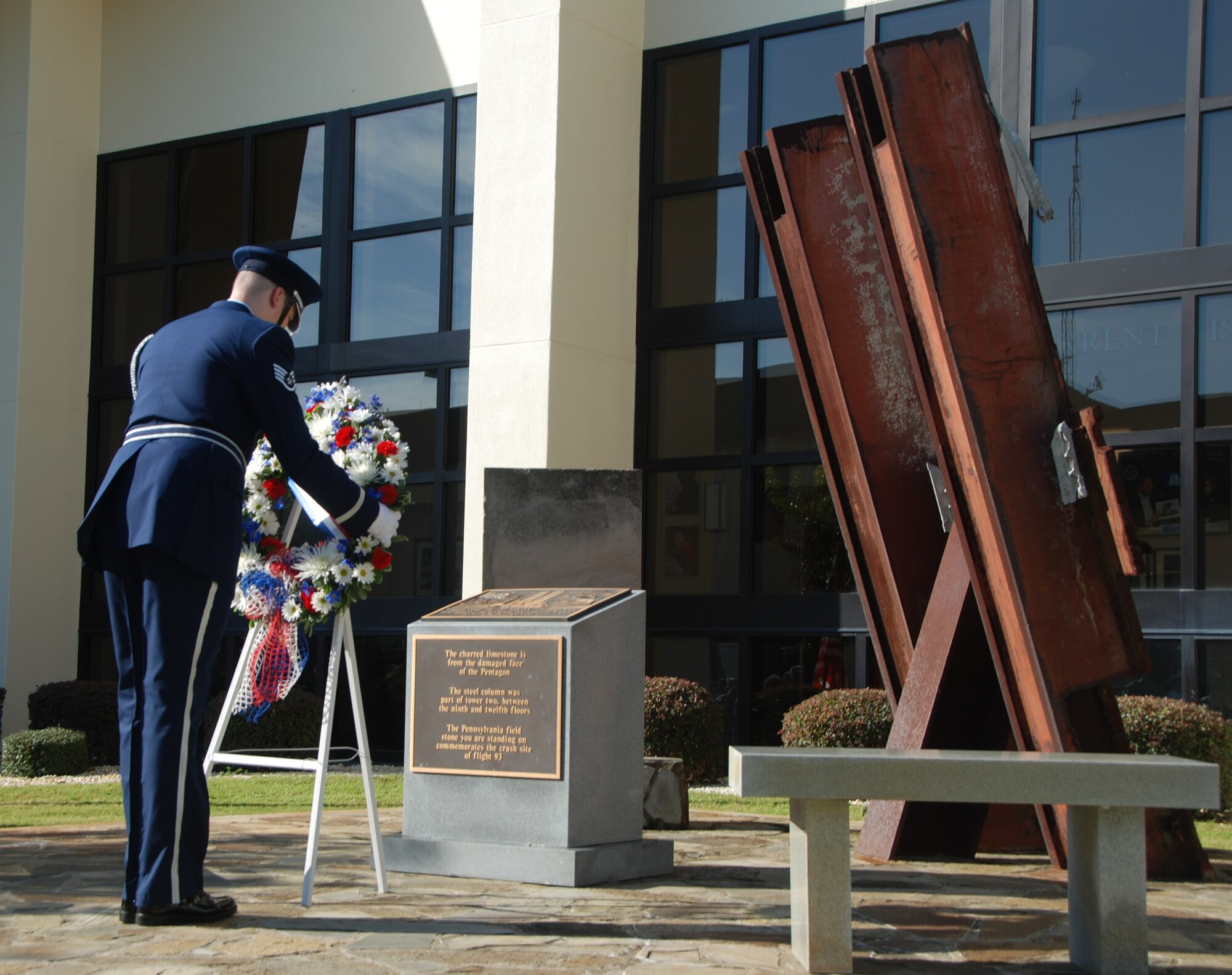 U.S. Air Force Staff Sgt. Matthew Hordeski, a member of the 601st Air and Space Operations Center Color Guard, lays a wreath at the 9/11 Memorial at the 601st AOC Sept. 11, 2014, at Tyndall Air Force Base, Fla. The 601st AOC held a ceremony to honor the memory of those who lost their lives during the tragic events of Sept. 11, 2001. (Air National Guard photo by Capt. Jared Scott/Released)
