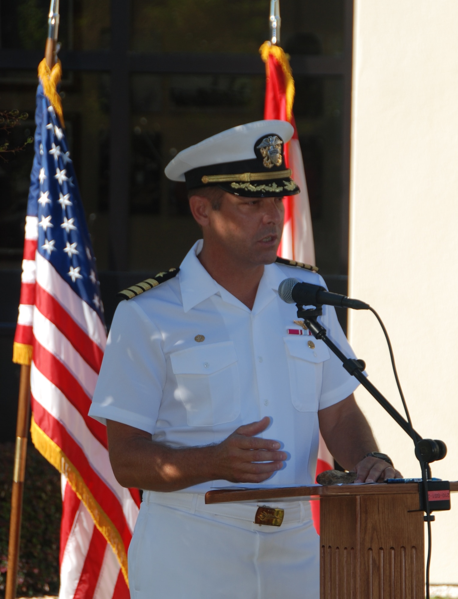 U.S. Navy Capt. Robert Rasmussen, 601st Air and Space Operations Center deputy commander, speaks to the crowd during a memorial service Sept. 11, 2014, in front of the 601st AOC at Tyndall Air Force Base, Fla. The 601st AOC held a ceremony to honor the memory of those who lost their lives during the tragic events of Sept. 11, 2001. (Air National Guard photo by Capt. Jared Scott/Released)
