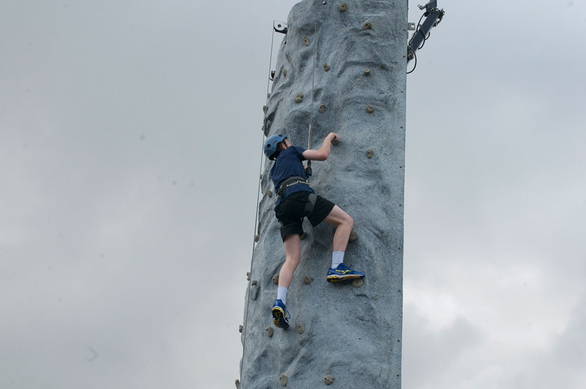 A cadet climbs a wall as part of the 2014 Raider Cup Competition.  The climbing wall tests strength-to-weight ratio, agility, flexibility and coordination. Cadets from all around the Anchorage bowl competed, but Dimond High’s Army team took home the cup. (U.S. Army photo/Sgt. Brian Ragin)

