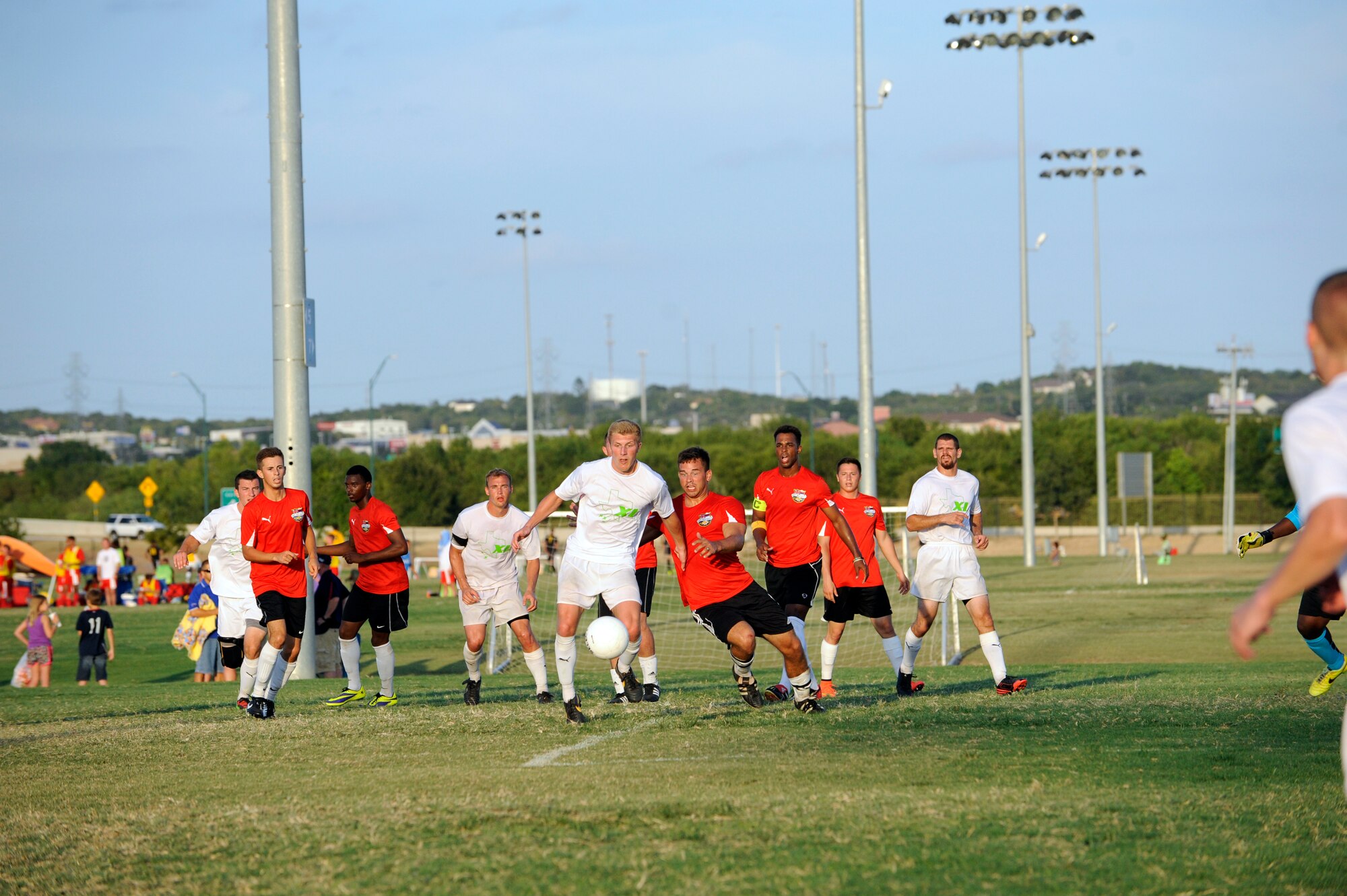 Second Lt. Brian Klazura, 47th Student Squadron student pilot, center, readies to receive the ball at South Texas Area Regional Soccer Complex in San Antonio Texas, Aug. 31, 2014. Laughlin Football Club made it to the semifinals during their first year in the Defender’s Cup tournament, with their only loss being against Hawaii by two goals. (U.S. Air Force photo by Airman 1st Class Jimmie D. Pike)(Released)