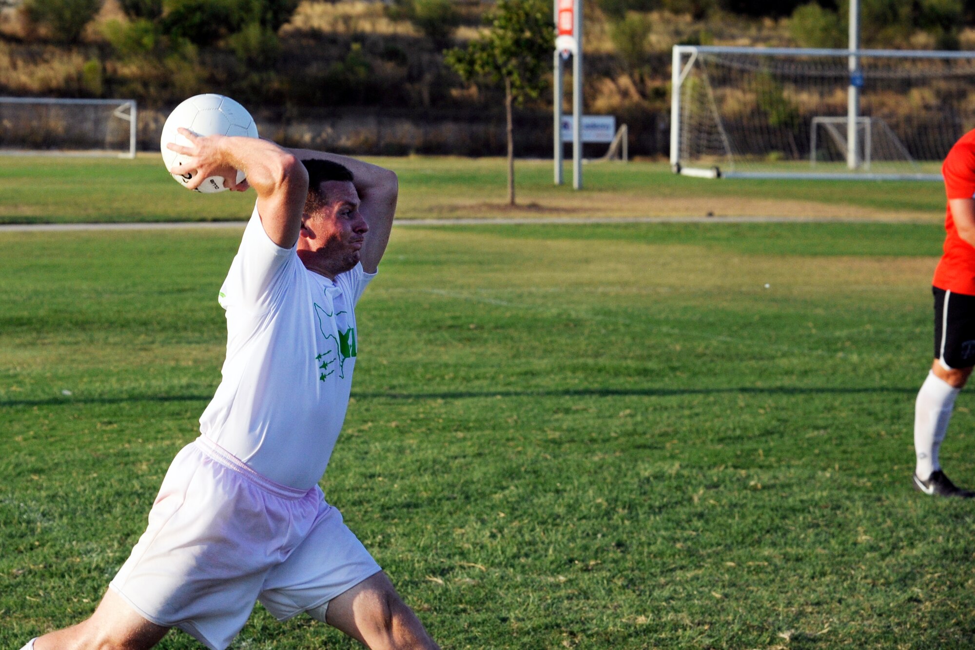 Second Lt. Ian McGee, 47th Student Squadron student pilot, performs a throw-in during the Defender’s Cup at the South Texas Area Regional Soccer Complex in San Antonio, Texas, Aug. 31, 2014. Laughlin Football Club competed for their first time in the tournament against 37 other teams. (U.S. Air Force photo by Airman 1st Class Jimmie D. Pike)(Released)