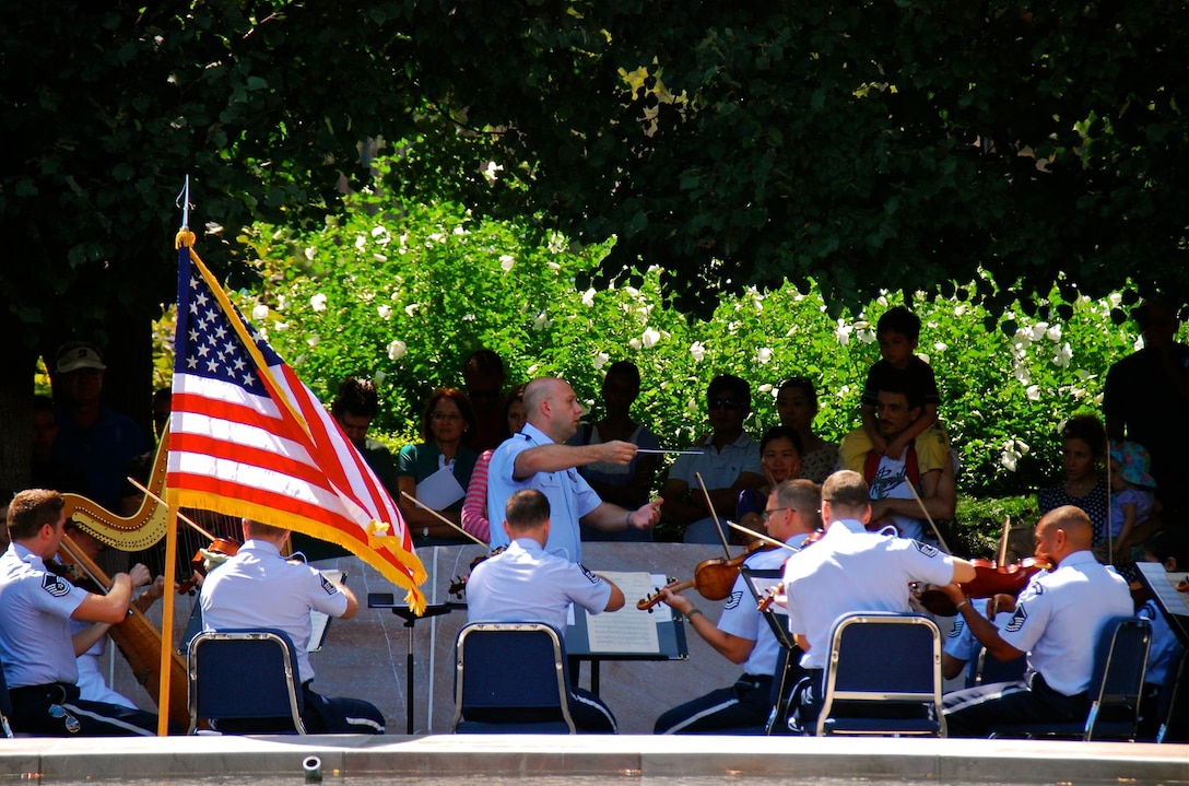 The Air Force Strings, under the direction of Captain David Alpar, performed outside the National Gallery of Art on a beautiful Sunday afternoon.  They entertained listeners of all ages with two exciting string orchestra programs. (US Air Force Photo by Senior Master Sgt. Bob Kamholz/released)