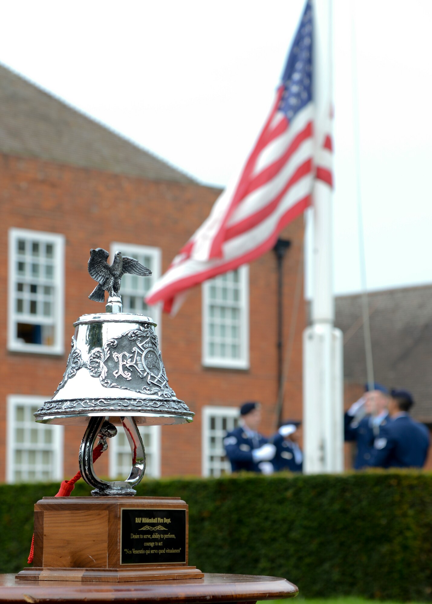 A bell known as the “Last Shift Bell” is displayed during a retreat ceremony Sept. 11, 2014, on RAF Mildenhall, England.  Originally the bell was used to signify the end of a shift, but during this ceremony Airmen rang the bell to pay tribute to the victims of the 9/11 terrorist attacks. (U.S. Air Force photo/Senior Airman Victoria H. Taylor/Released)