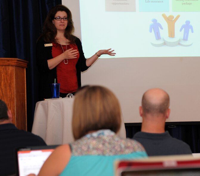 Amy Soeder, Airman & Family Readiness Center community readiness technician, gives the Personal Financial Readiness for Transition briefing during the Transition Assistance Program seminar on Barksdale Air Force Base, La., Sept. 8, 2014. . The A&FRC provides resources to Airmen in preparation for a smooth transition from military to civilian life. (U.S. Air Force photo/ Senior Airman Jannelle Dickey) 