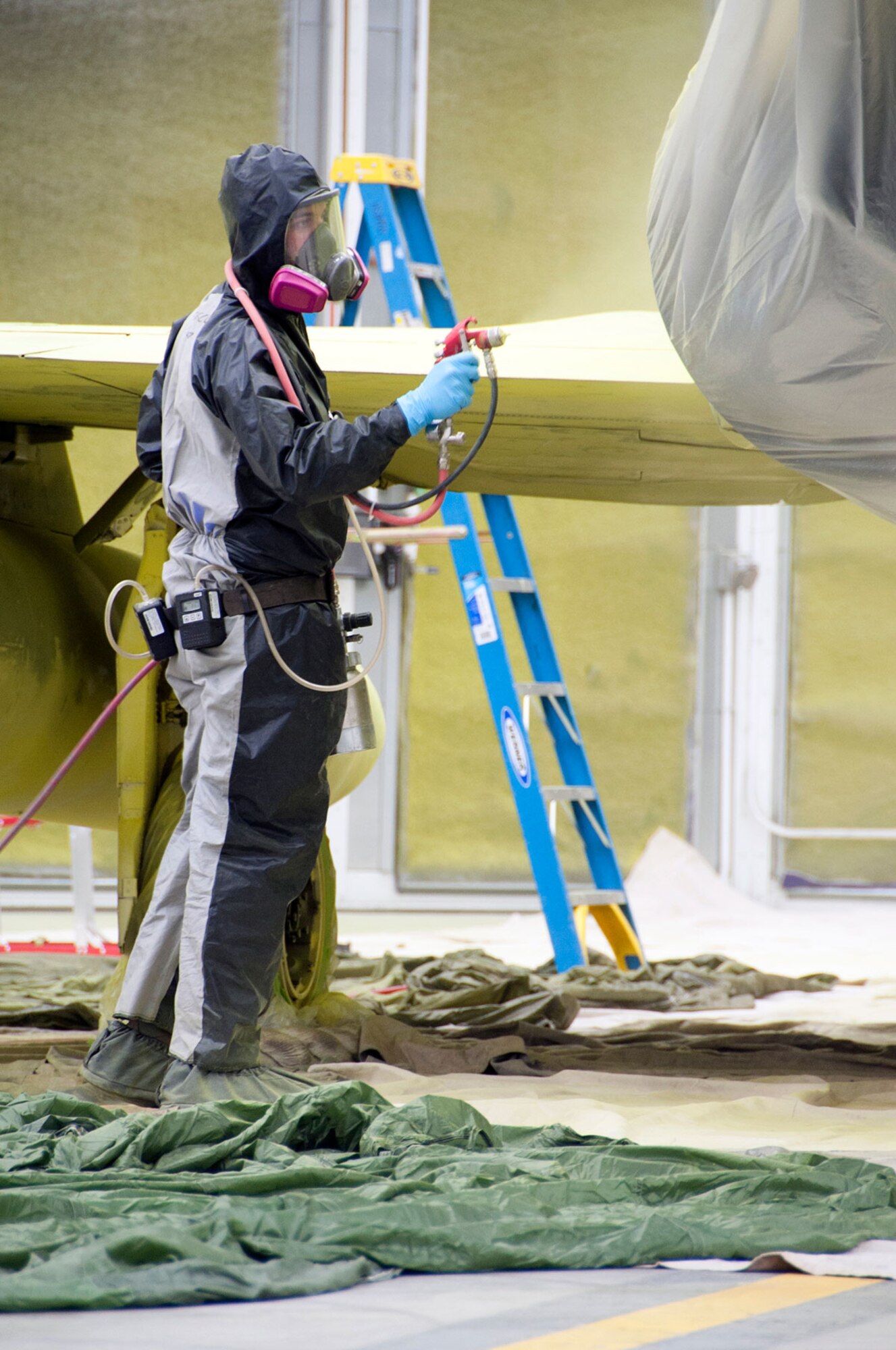 Airman 1st Class Joseph Guasco, 3rd Aircraft Maintenance Squadron aircraft maintenance apprentice, paints primer on an F-4 Phantom II on Joint Base Elmendorf-Richardson, Alaska, Sept. 4, 2014. The F-4 is one of the many historical aircraft that occupies Heritage Field across from the 3rd Wing Headquarters Building. The F-4 has been chosen to be refurbished due to corrosion from the elements of being outside. (U.S. Air Force photo/Airman 1st Class Tammie Ramsouer)