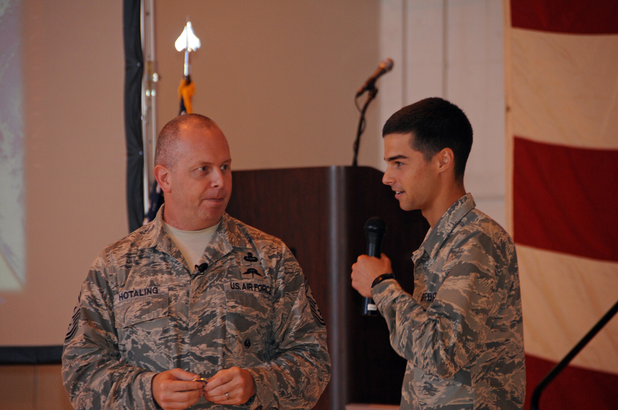 Command Chief Master Sergeant of the Air National Guard James W. Hotaling speaks with Airman Basic James Hishmeh, 190th Air Refueling Wing, Logistics Readiness Squadron during Chief Hotaling's Enlisted All Call meeting Sept. 6, 2014. Airman Hishmeh is just 30 days out of completing basic training and provided the pesrpective of a new Airman during the meeting. (U.S. Air National Guard photo by Tech. Sgt. Mandy Johnson)
