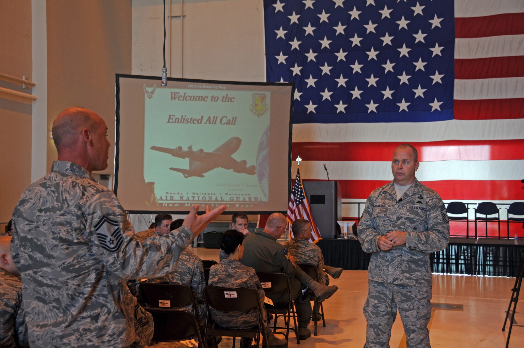 Command Chief Master Sergeant of the Air National Guard James W. Hotaling fields a question from Senior Master Sgt. Rob Bolin of the 190th Air Refueling Wing Operations Group during Chief Hotaling's Enlisted All Call meeting Sept. 6, 2014. (U.S. Air National Guard photo by Tech. Sgt. Mandy Johnson)