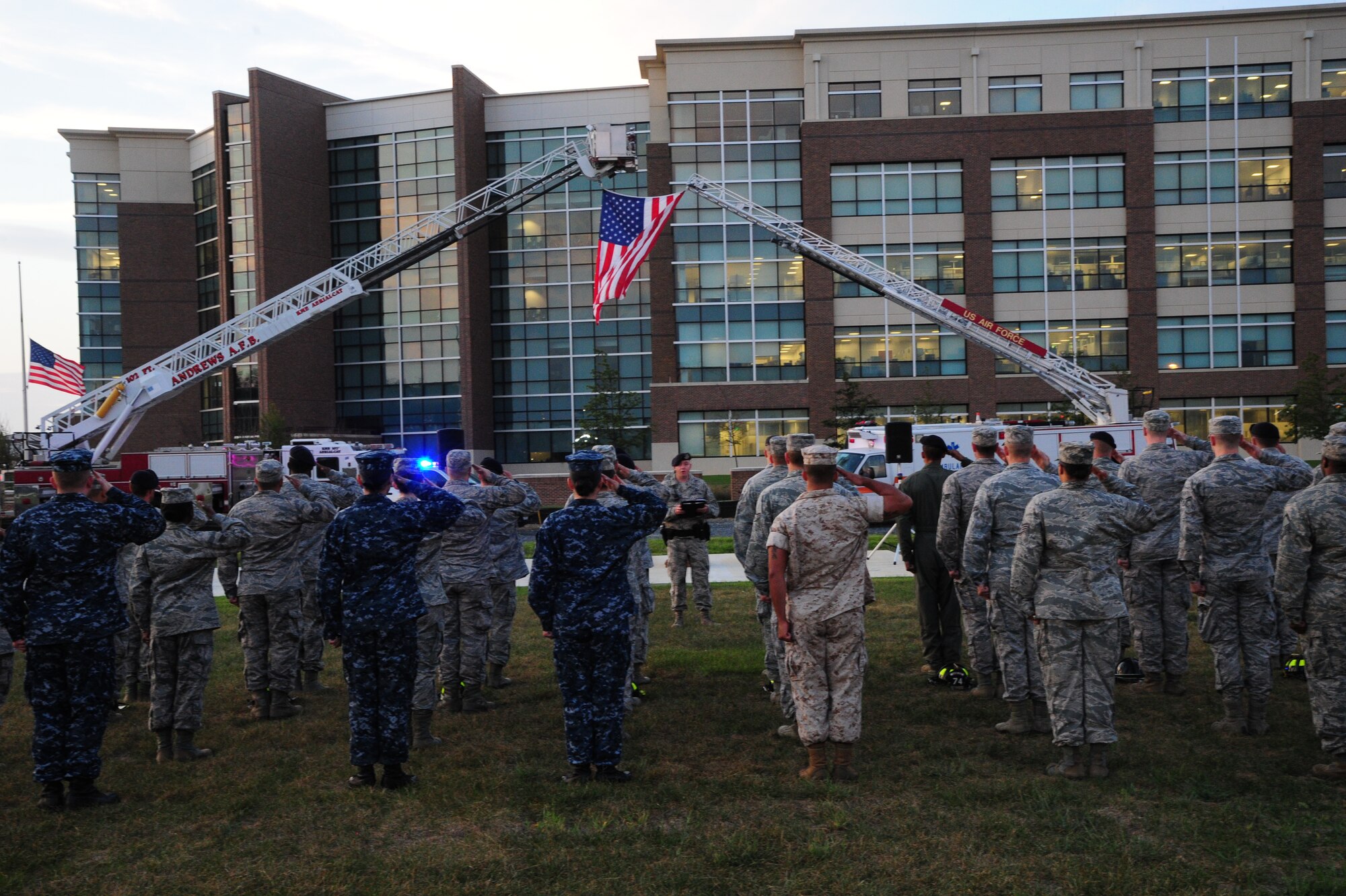 First responders salute during morning reveille on Sept. 11, 2014 at Joint Base Andrews, Md. The morning reveille paid respect to all those who lost their lives in the Sept. 11, 2001 attacks. (U.S. Air Force photo/Airman 1st Class J.D. Maidens)