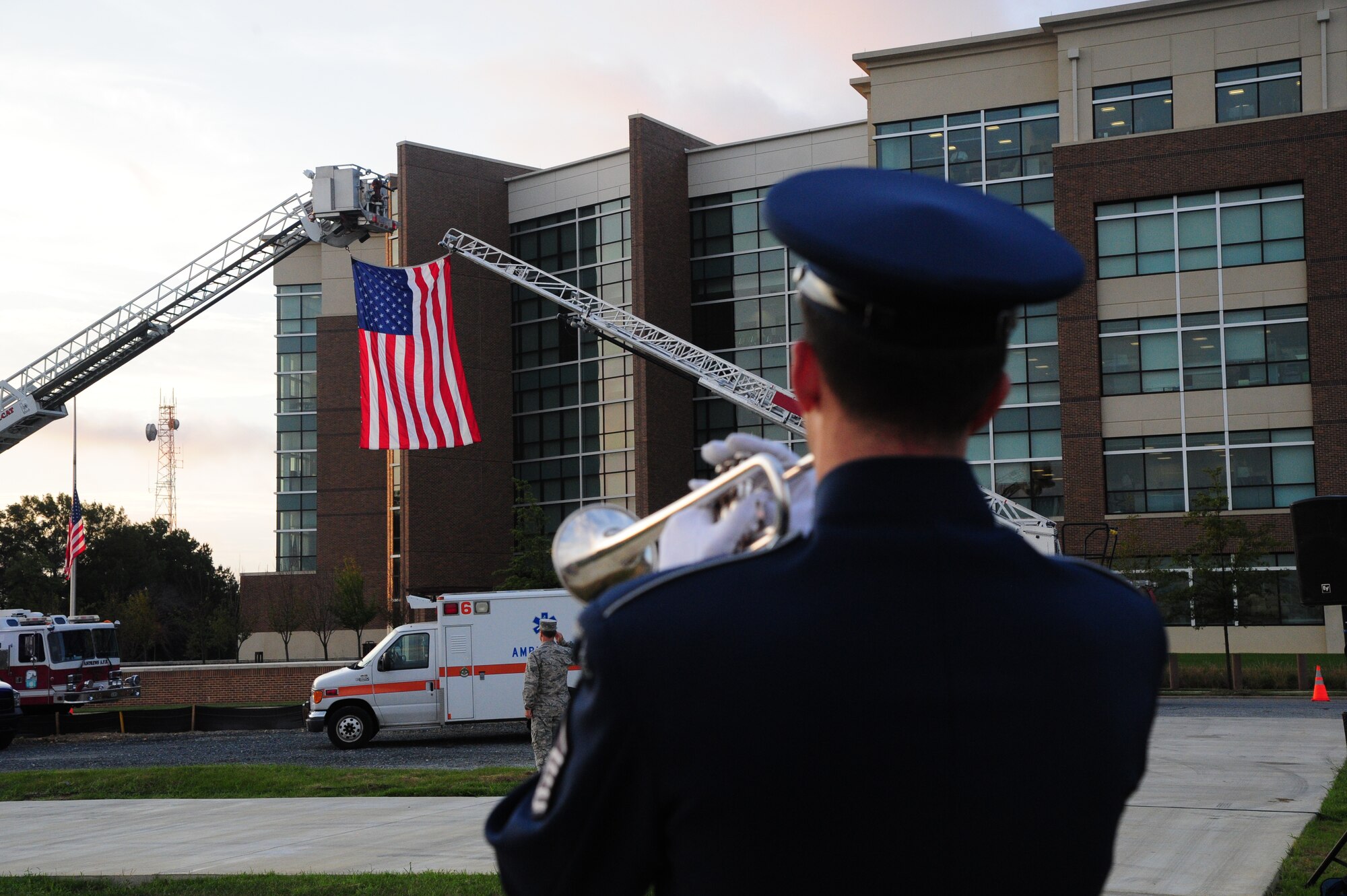 An Air Force Band Member plays taps during morning reveille on Sept. 11, 2014 at Joint Base Andrews, Md. The morning reveille paid respect to all those who lost their lives in the Sept. 11, 2001 attacks. (U.S. Air Force photo/Airman 1st Class J.D. Maidens)