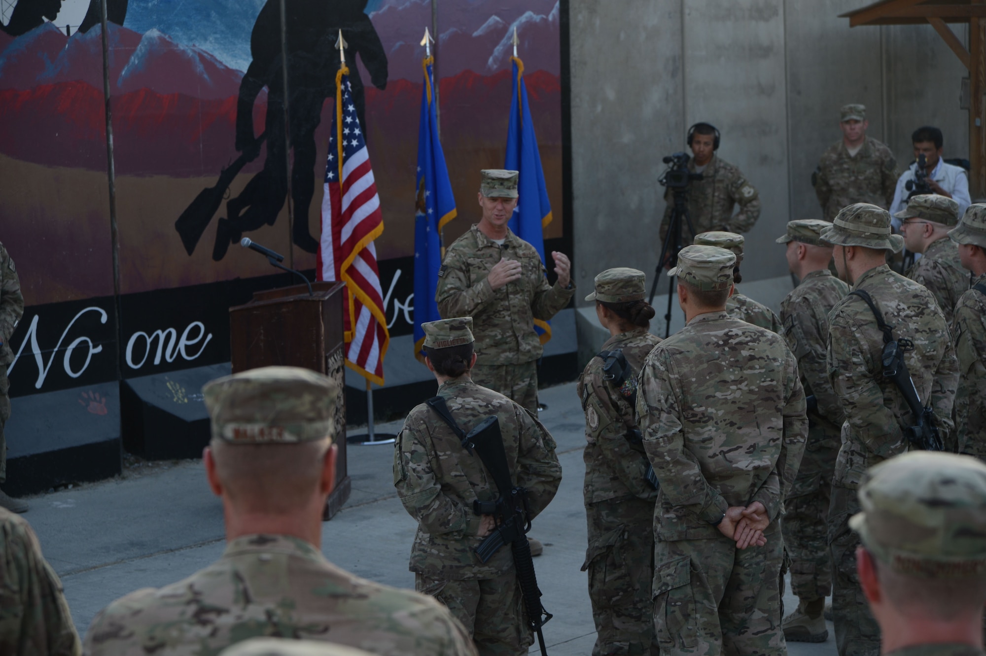 U.S. Air Force Brig. Gen. Mark D. Kelly, 455th Air Expeditionary Wing commander,  makes a few remarks about the importance of Patriot Day during a retreat and re-enlistment ceremony held outside the 5/6 Tent Sept. 11, 2014 at Bagram Airfield, Afghanistan. Patriot Day is remembered globally as the anniversary of the terrorist attacks in the United States Sept. 11, 2001. (U.S. Air Force photo by Master Sgt. Cohen A. Young/Released)