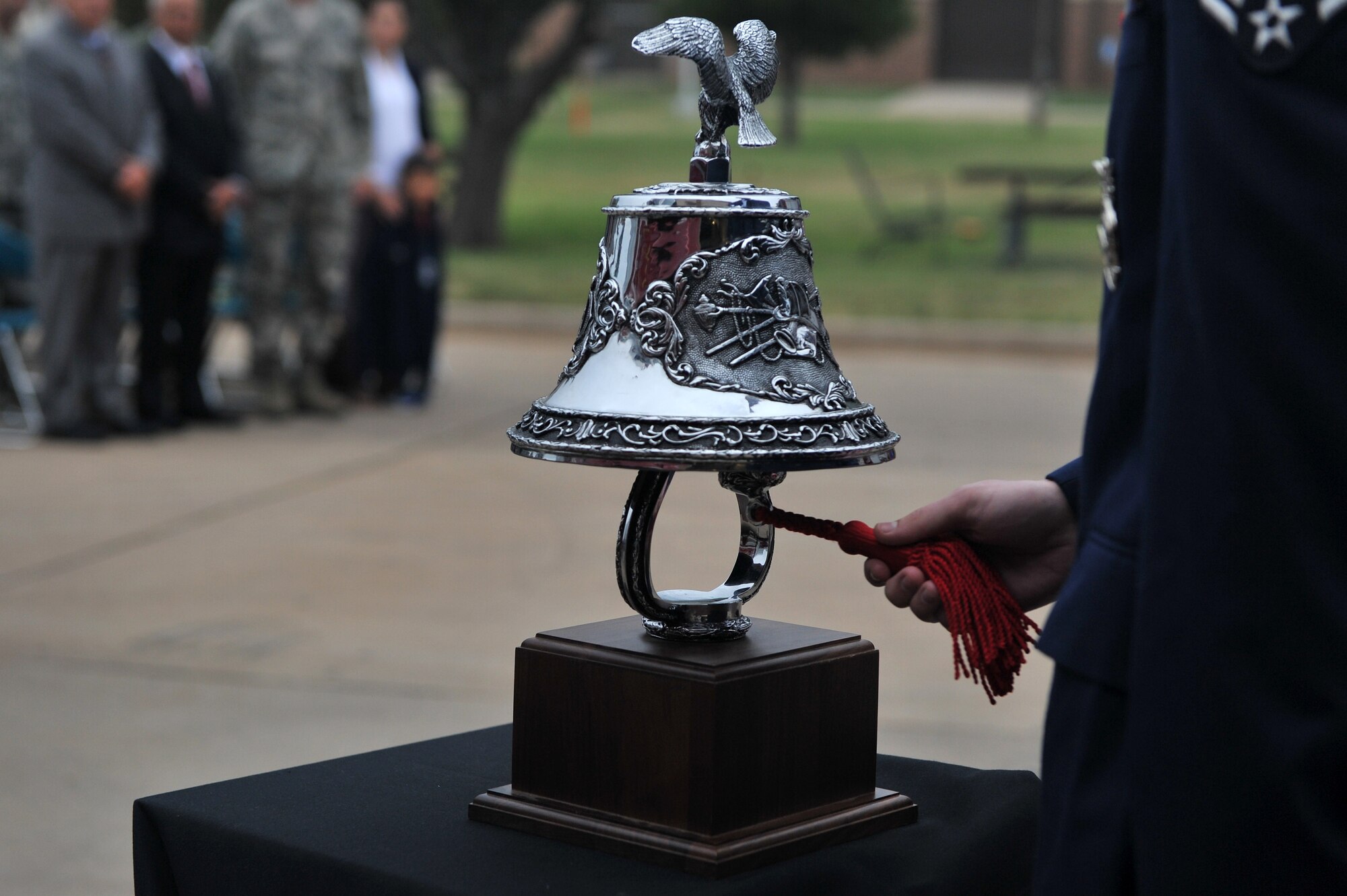 ALTUS AIR FORCE BASE, Okla. – An Airman from the 97th Civil Engineer Squadron Fire Department sounds the final alarm during this year’s Patriot Day ceremony outside the base fire station Sept. 11, 2014. The final alarm rang in closure and paid tribute to the ultimate sacrifice made by the fallen emergency responders on Sept. 11, 2001. (U.S. Air Force photo by Senior Airman Dillon Davis/Released)