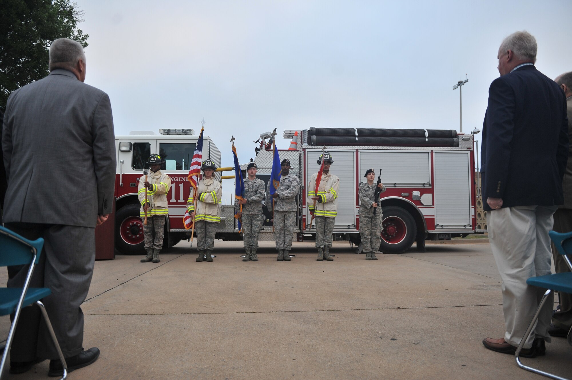 ALTUS AIR FORCE BASE, Okla. – Members of the 97th Security Forces Squadron and the 97th Civil Engineer Squadron present the colors during this year’s Patriot Day ceremony outside the base fire station Sept. 11, 2014. The ceremony was held to honor the 343 firefighters and 23 police officers lost during the tragic events on Sept. 11, 2001. (U.S. Air Force photo by Senior Airman Dillon Davis/Released)